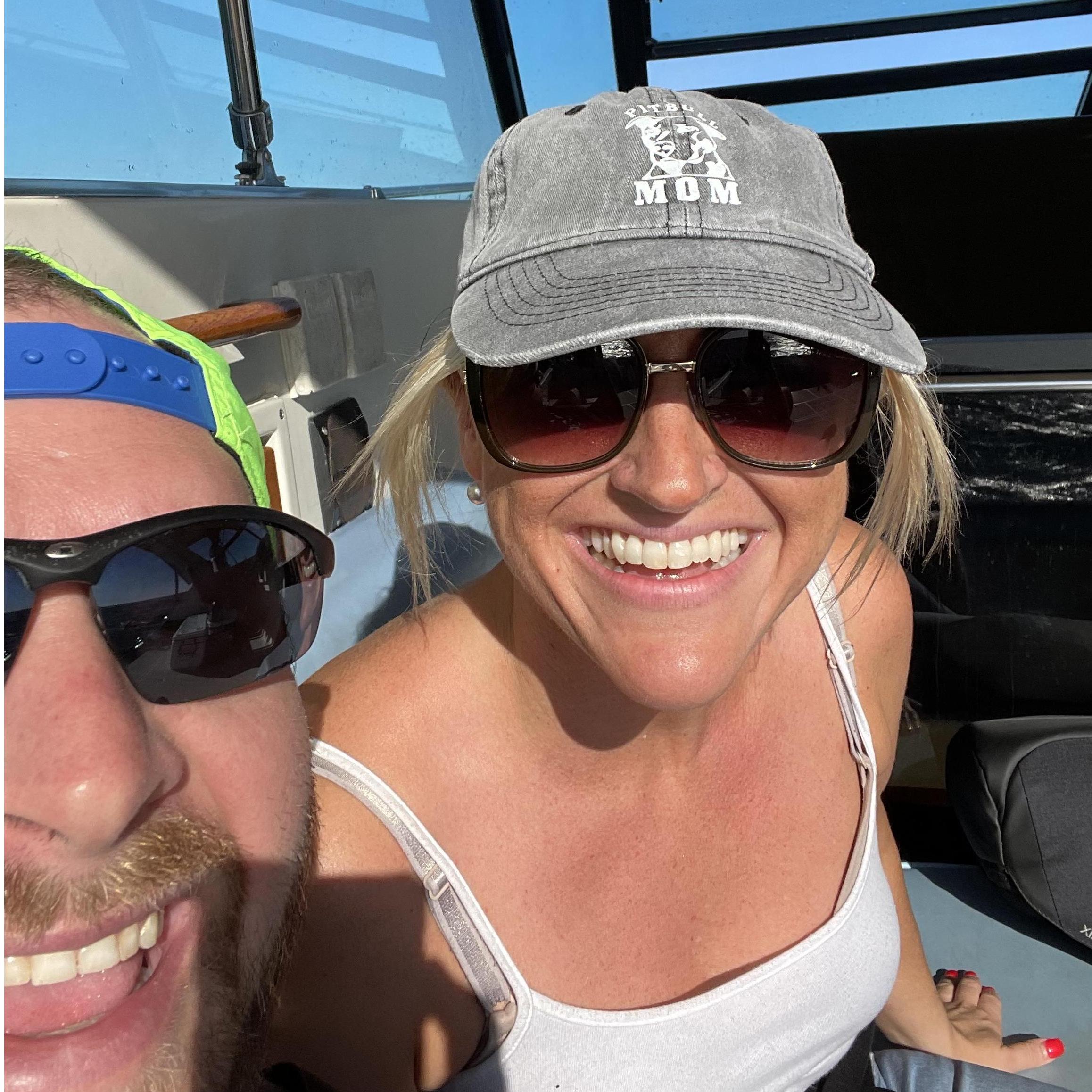 Don't be fooled. Laurie may be smiling but that's only after she spent the past hour laying on her back trying not to watch the waves jostling the boat. She was terrified but smiled for the photo.