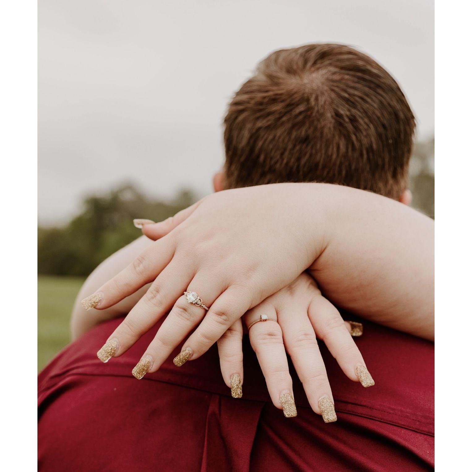 Showing off the promise ring and the engagement ring!