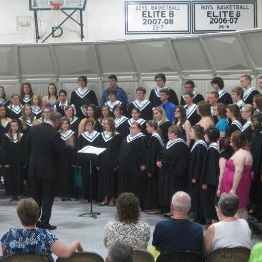 2011 Groom is third row up in the middle with the huge smile and Bride is 6th from the right