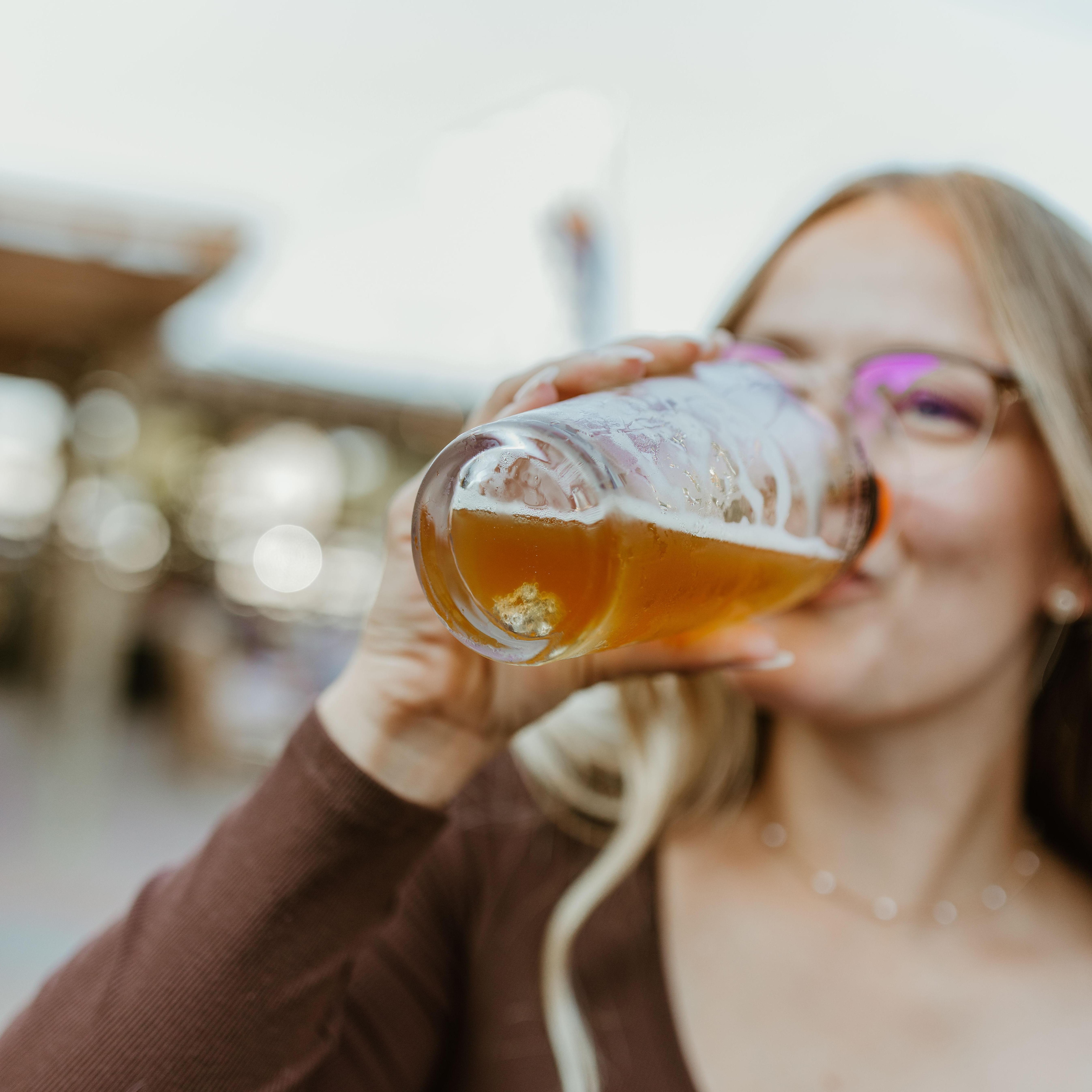 While trying to set up a beautiful picture of Hailee's engagement ring, the photographers accidentally dropped it into a pint of beer. 

The only way to get it out? Drink up!