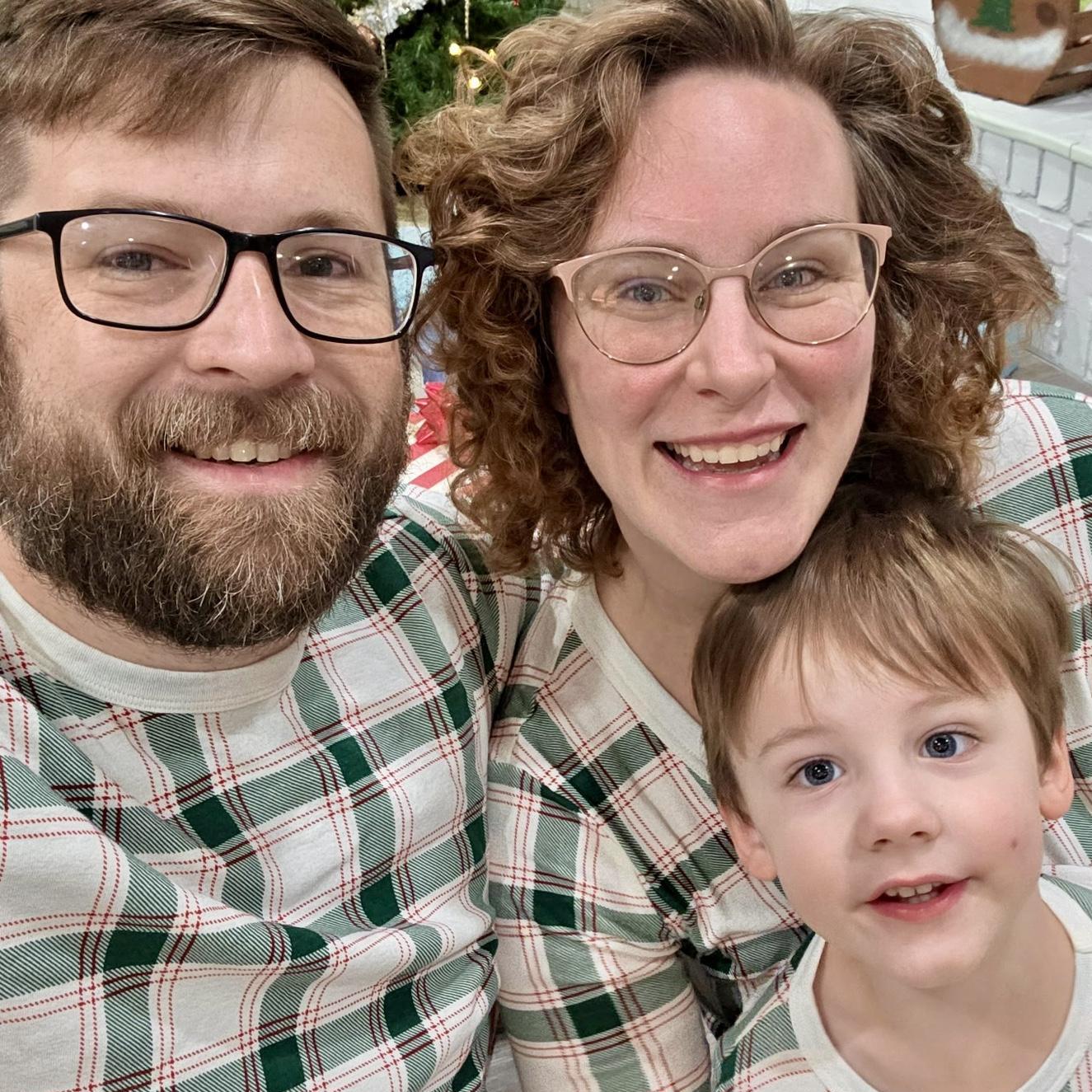 Matching Christmas morning PJs! (The newly constructed climbing dome in the backyard is the reason we look so tired that morning)