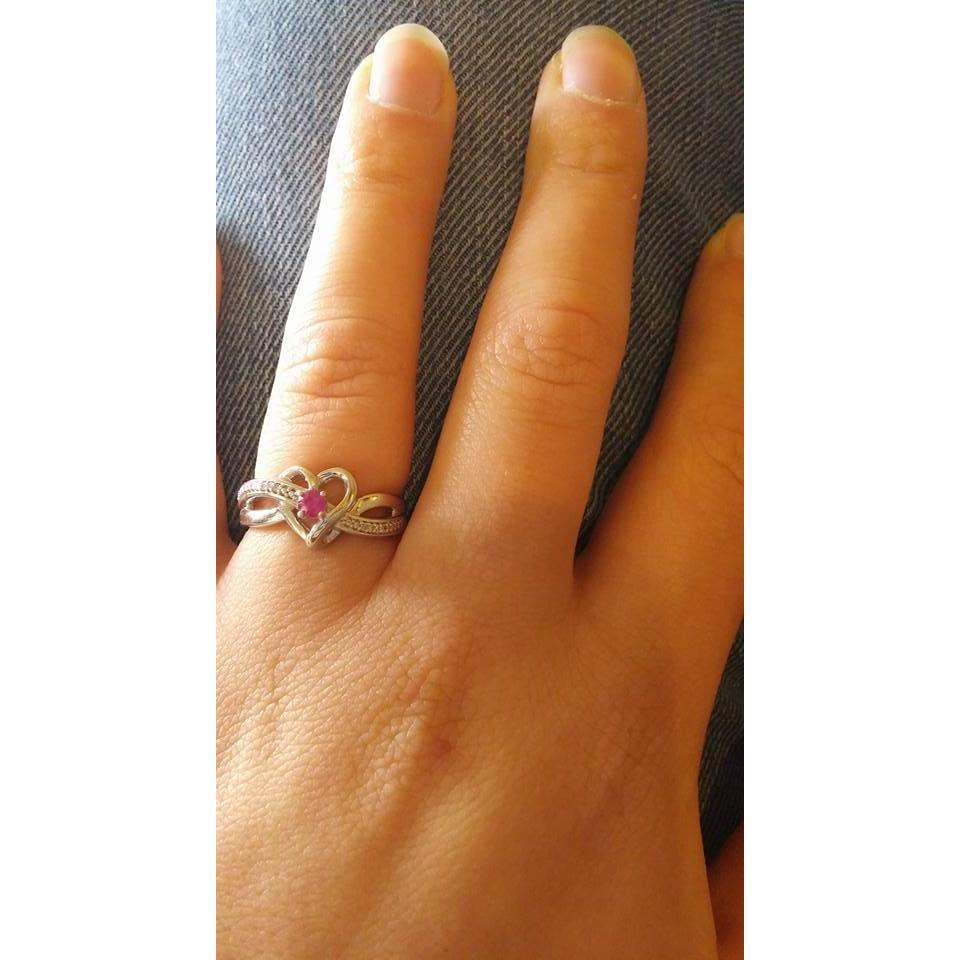The beautiful promise ring Nathan bought Taylor on their first Christmas. The message inside says, "Love Nathan". The gem is the birthstone of the month they started dating. December 25, 2015