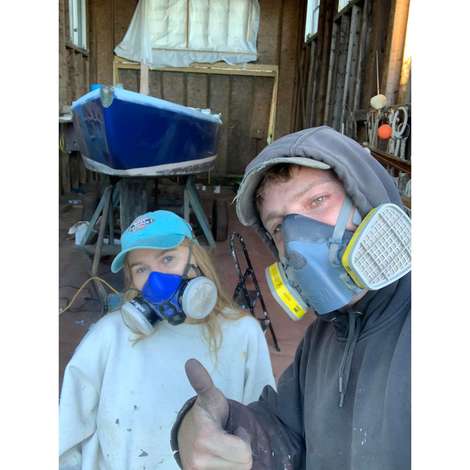 Painting Loose Marbles at Eaton's Boatyard in June of 2022. Gordon taught Flannery everything she knows about painting boats!