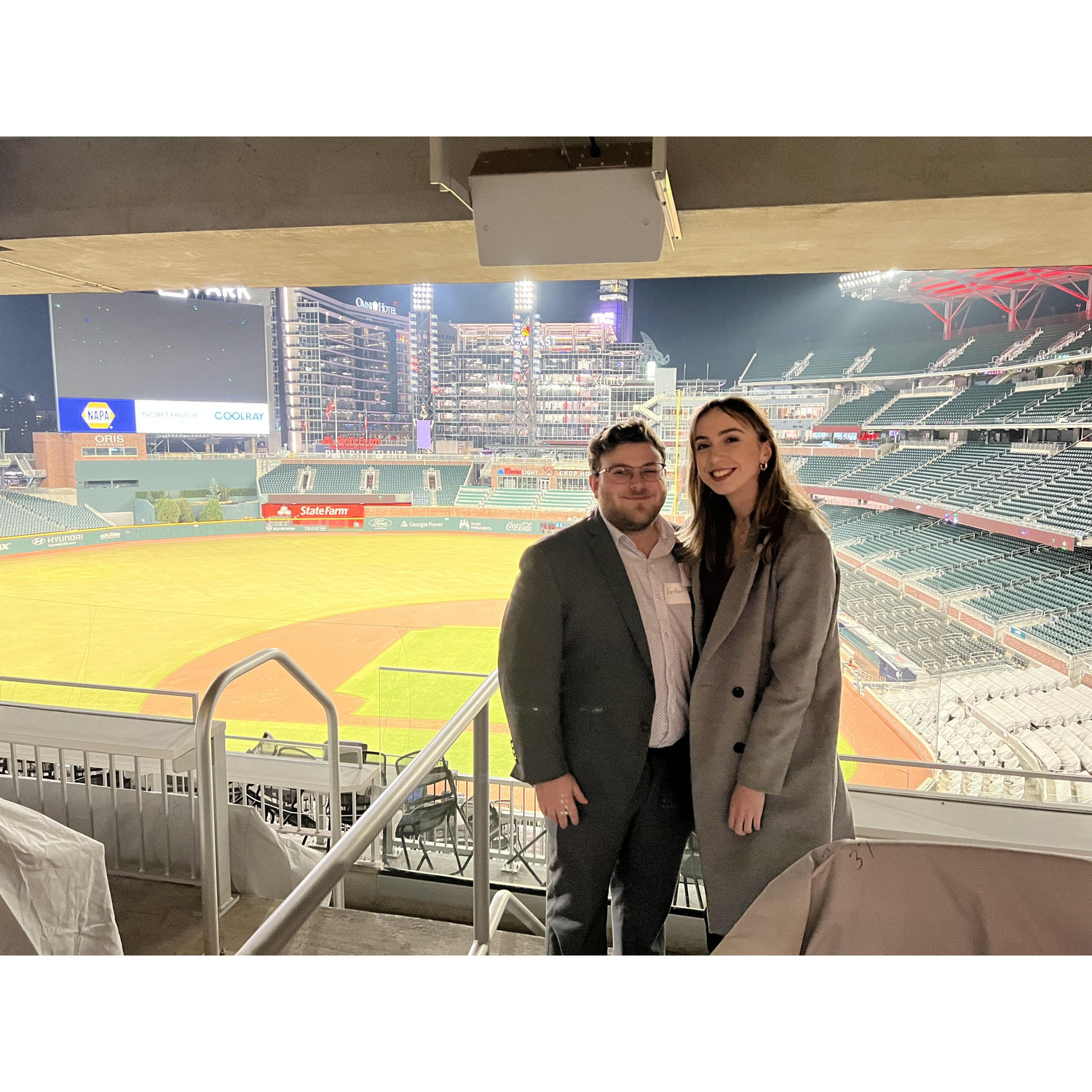 In December 2022, before they ever started dating, Libby asked Jordan to be her plus one to the Booz Allen holiday party at Truist Park. This is our first photo taken together.
