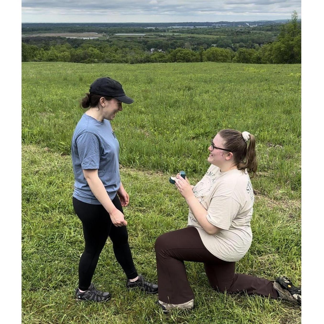 Johna proposing to Mikala at their favorite hiking spot.