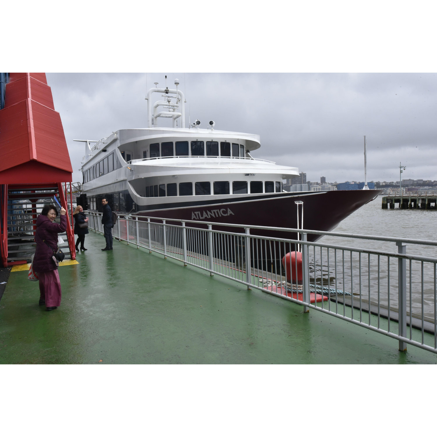 Tess walking towards the boat which is docked at Pier 61 of Chelsea Piers