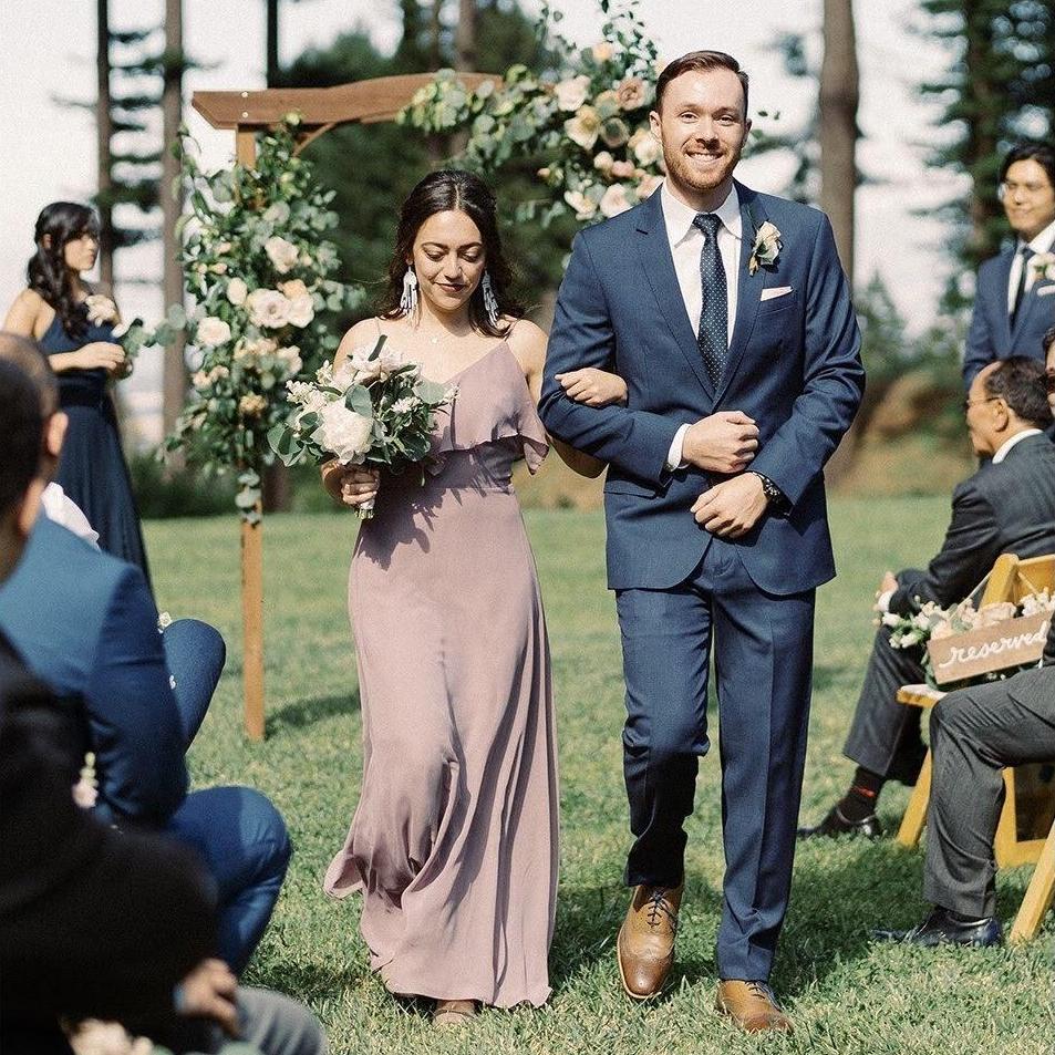 Walking down the aisle at our friends' wedding in 2019.