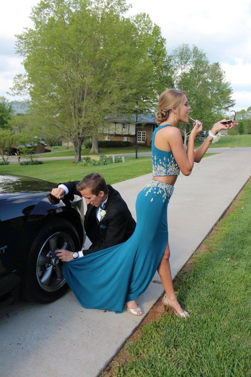 Senior prom in 2016! Typical guy.. cleaning his wheels with MY dress!