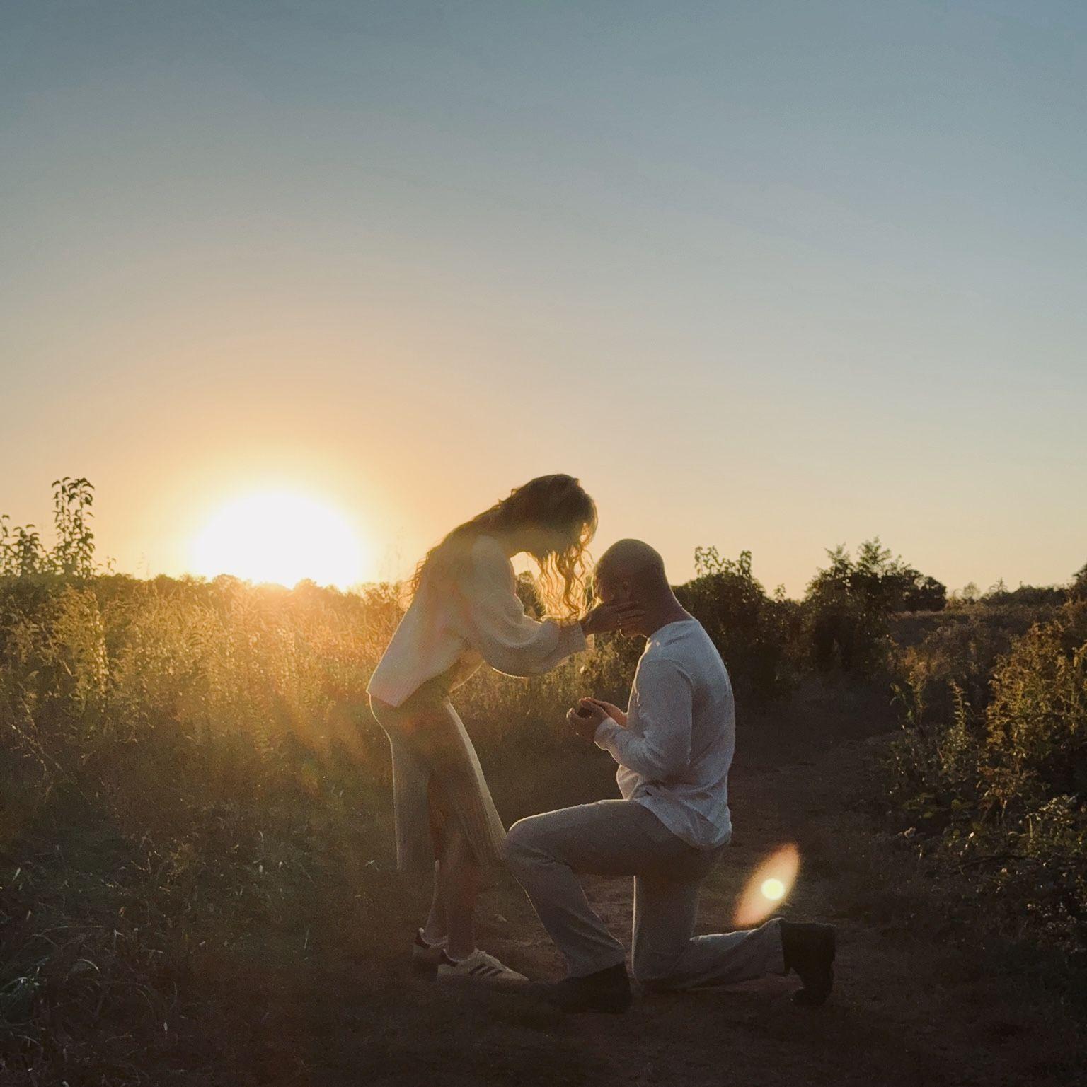 The moment he asked me to marry him!! Shout out to his sister Jenna for hiding in the woods lol.