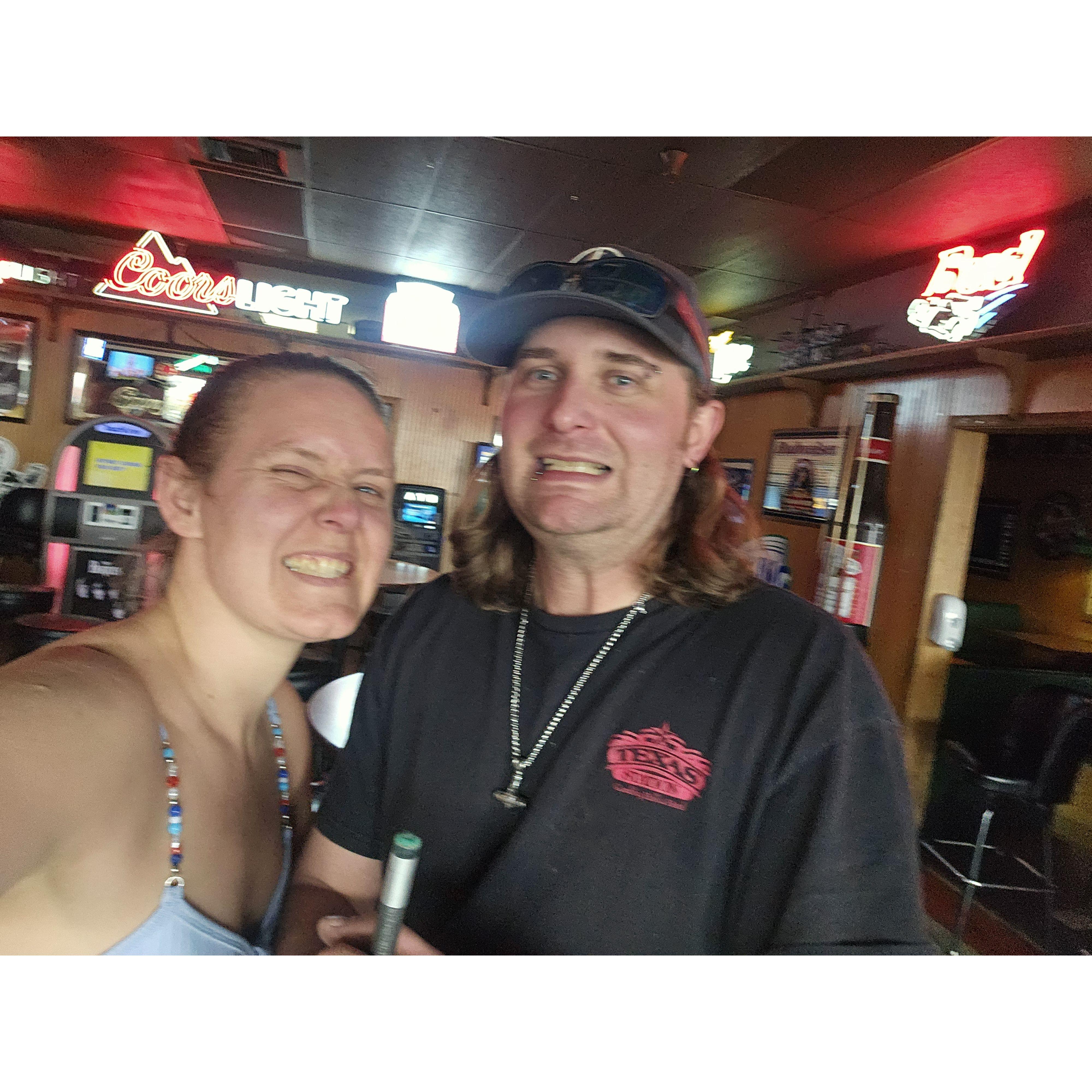 Out playing pool having a blast being silly