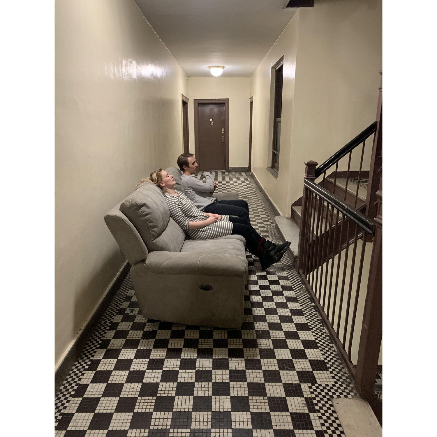 Taking a break in the hallway after carrying our couch up 6 flights of stairs
