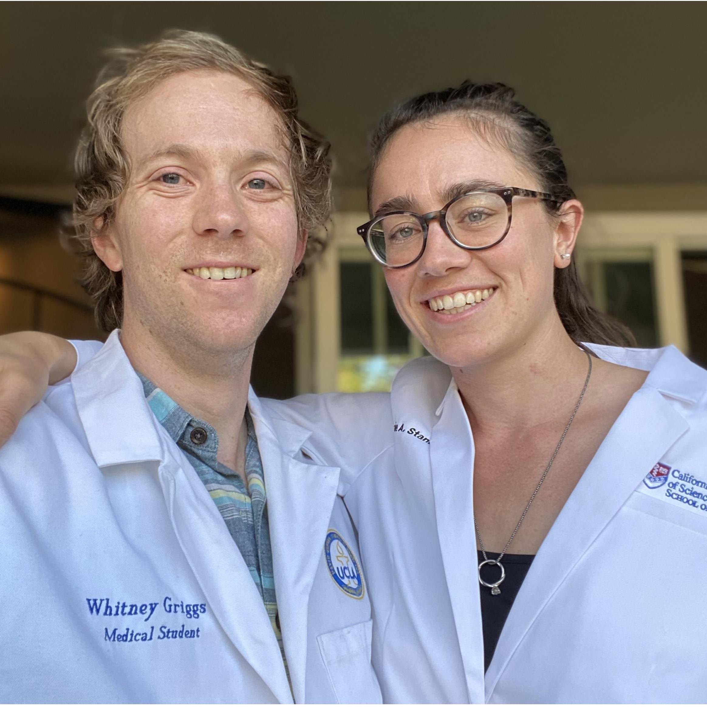 Showing off both of our customized white coats!