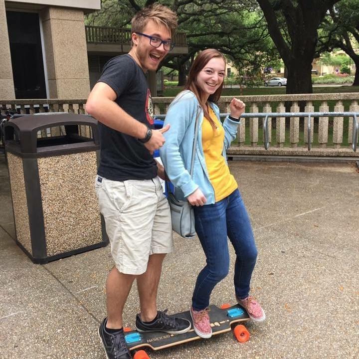 This is how we got around campus for awhile, before Devin's knees were done losing skin.