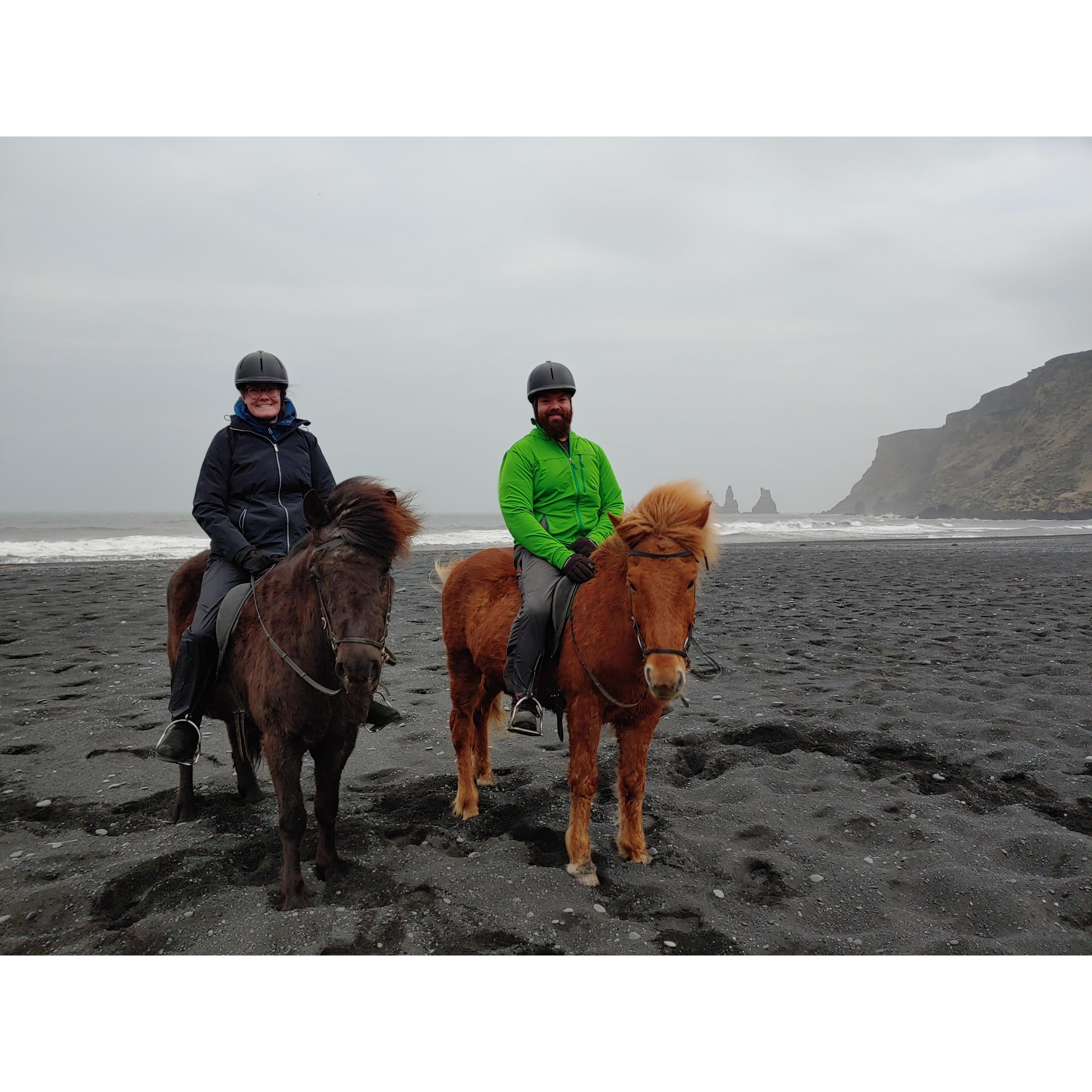 Riding horses on the Black Sand's Beach in Iceland