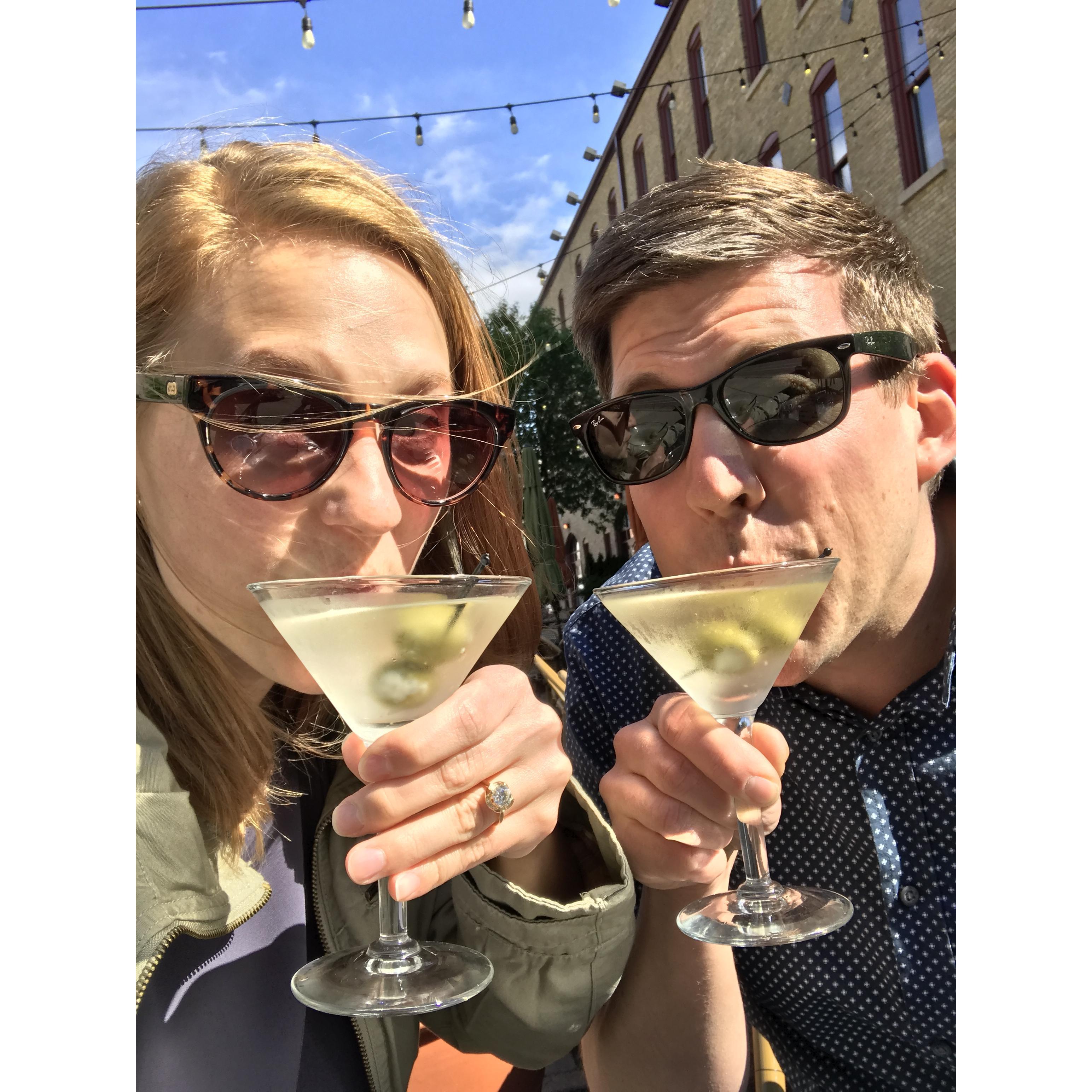 Basking in their engagement glow with dirty martinis.