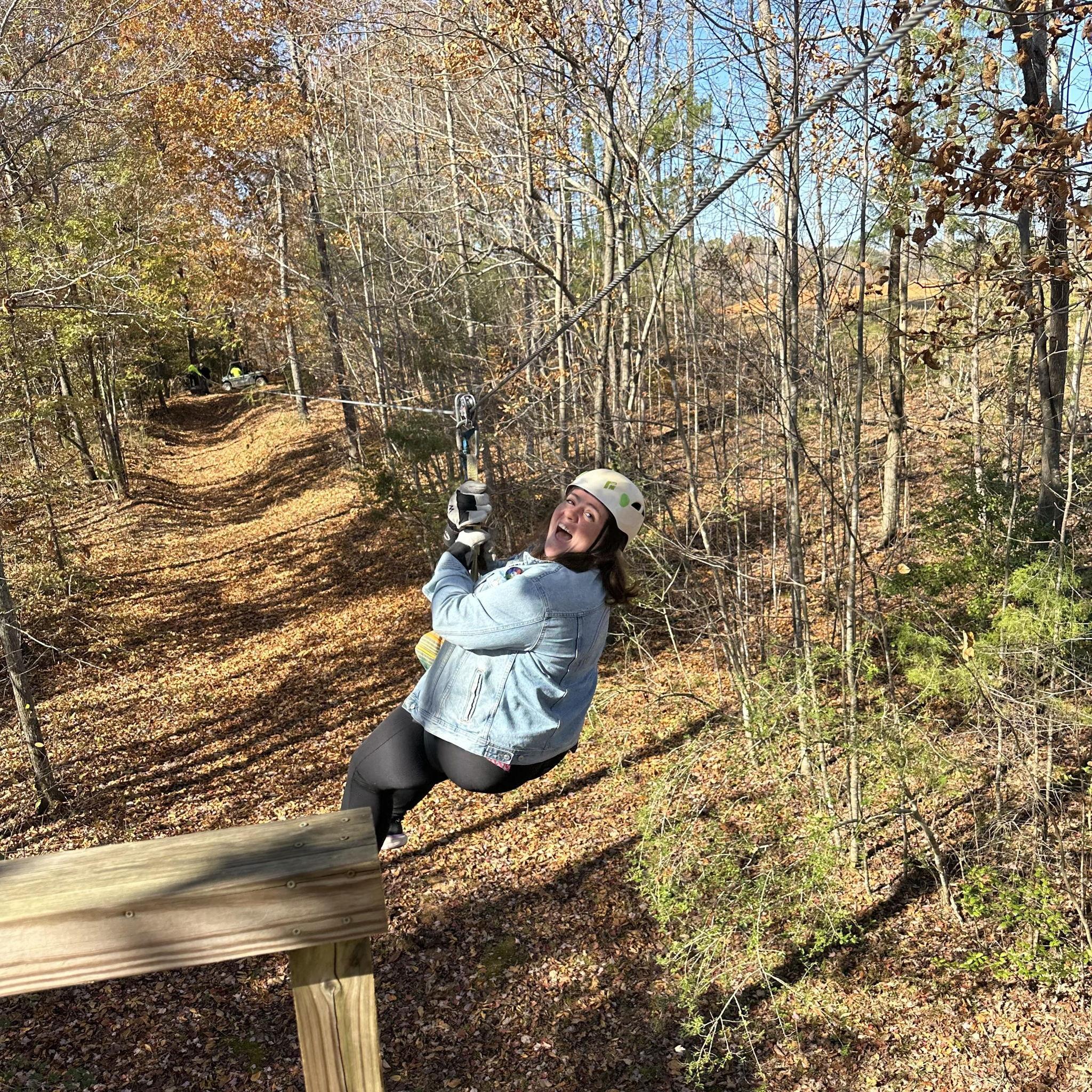 Victoria is having fun zip lining.