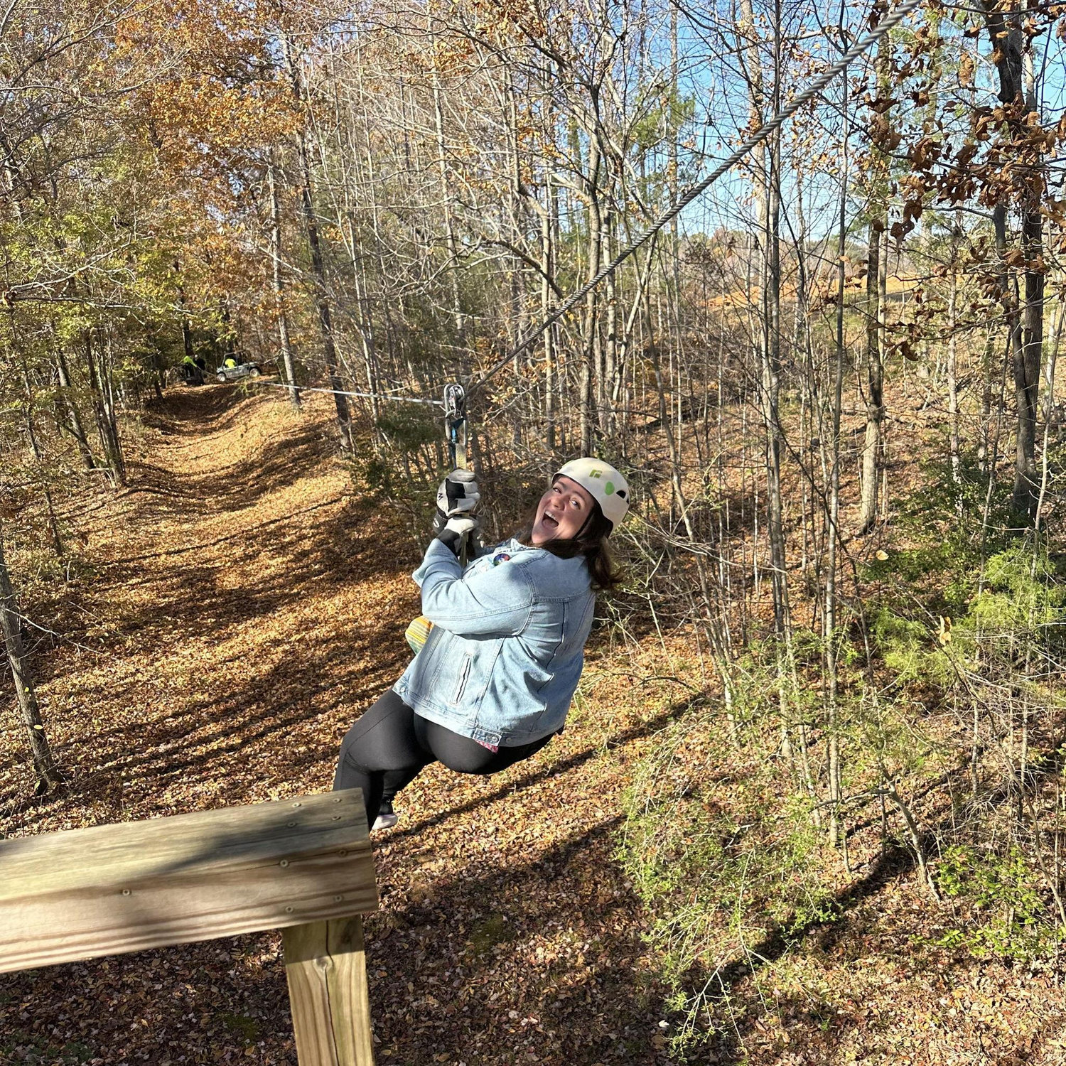 Victoria is having fun zip lining.