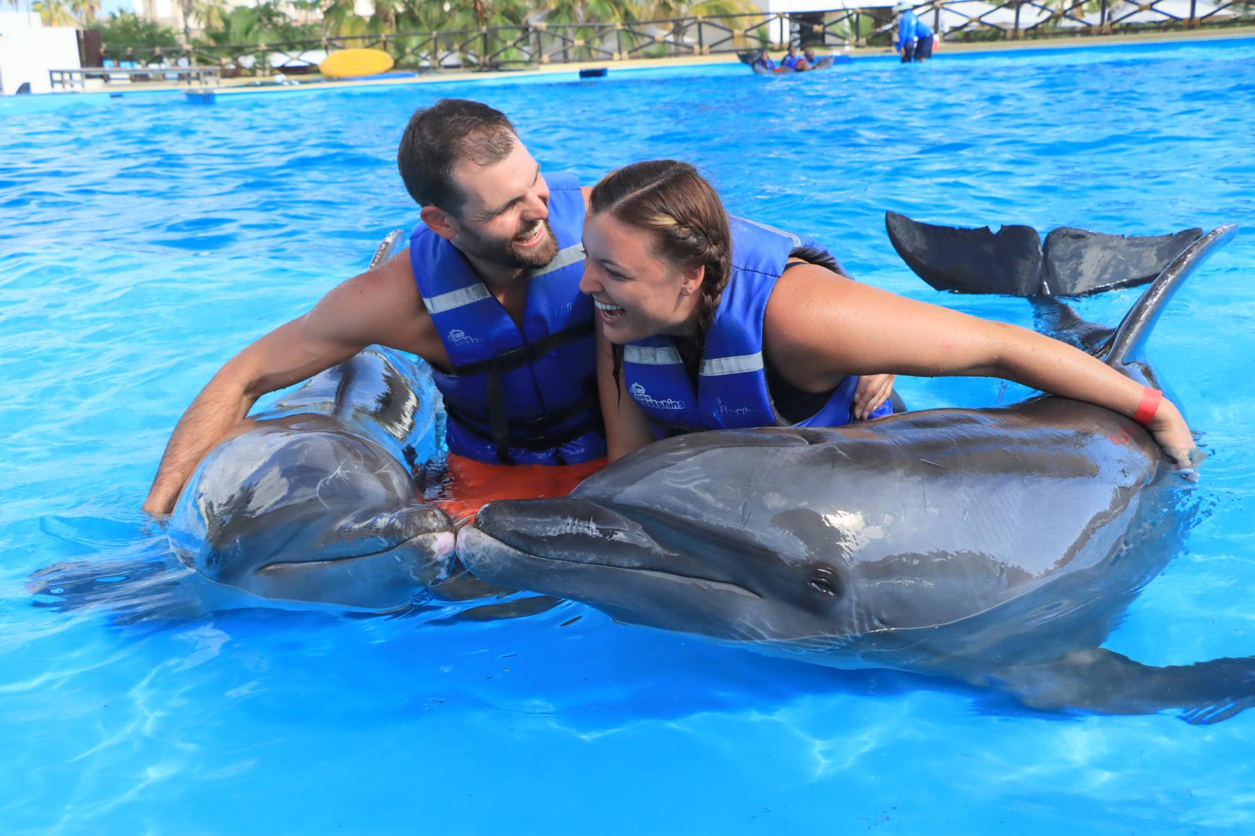 A bucket list item for McKenna - swimming with dolphins. Austin made it happen in Cabo 🐬