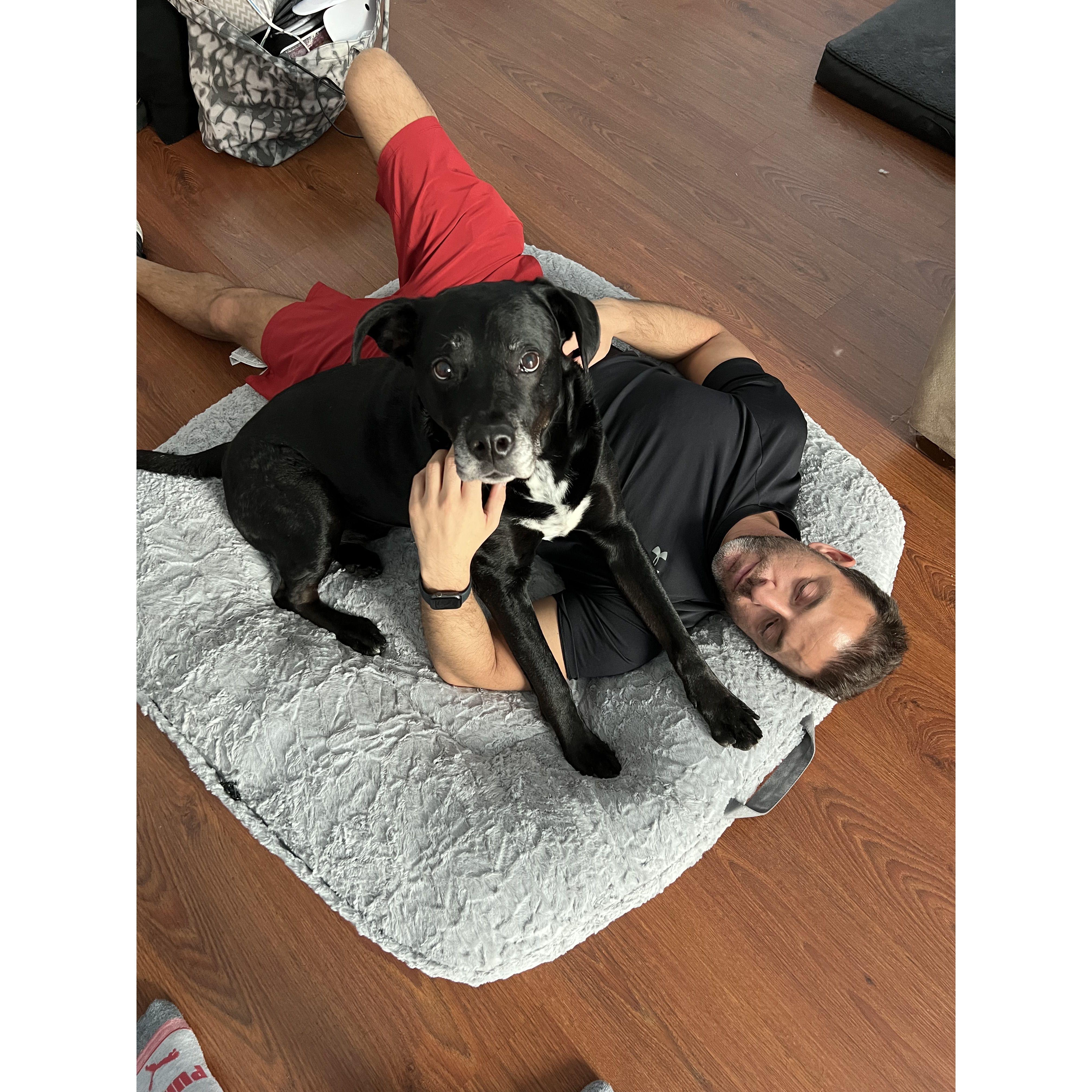 Testing the comfort level of Zeke's bed.