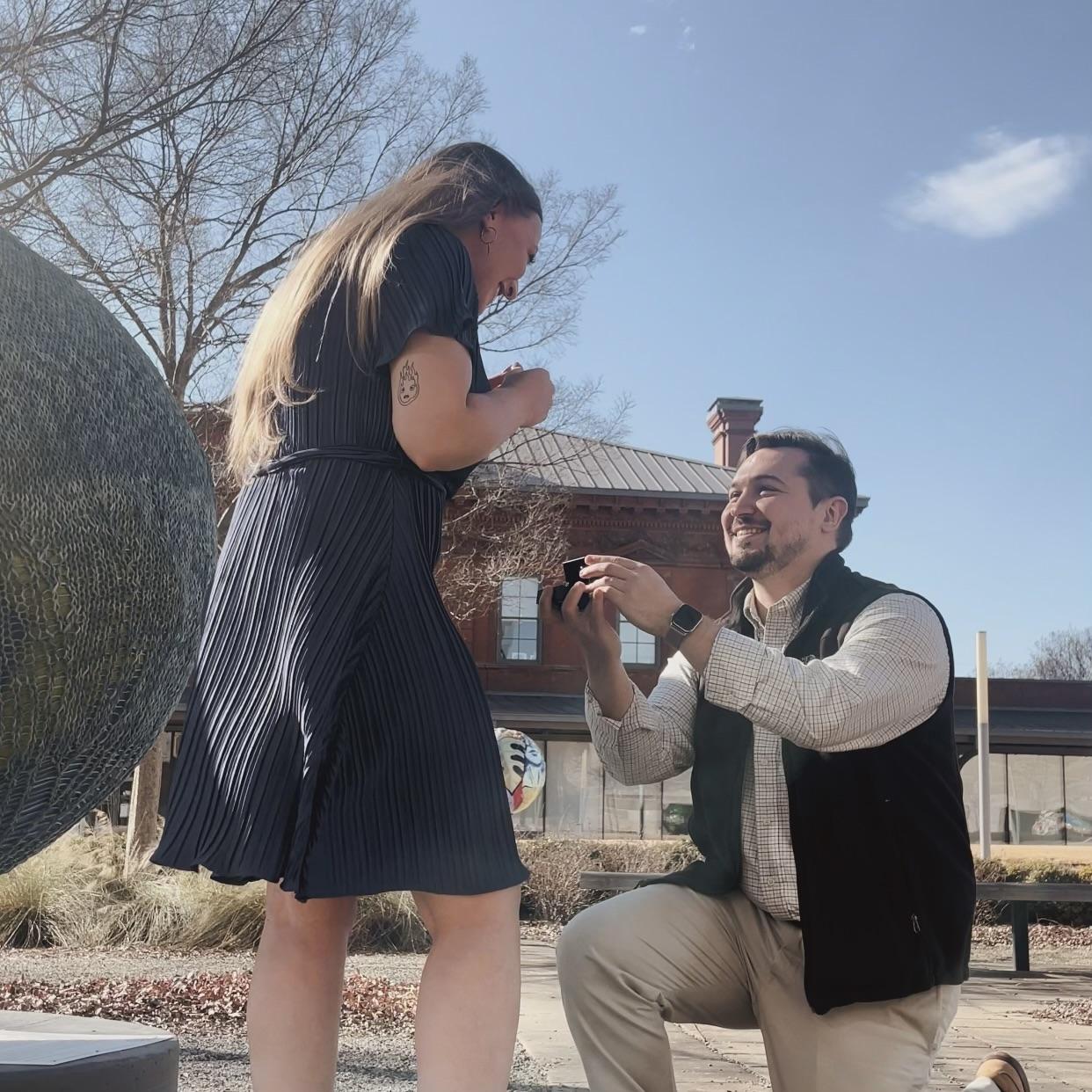 Ethan proposed in the ‘Cool Globes’ outdoor exhibit in front of the Clinton Presidential Center where we had one of our first dates.