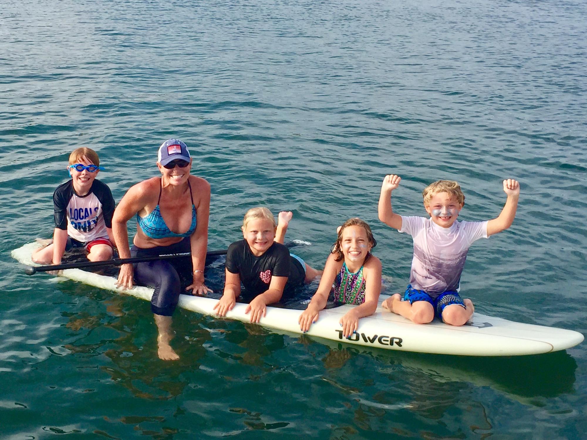 Paddleboarding in the Newport Bay off "Grandpa Tom's" boat. Summer 2017