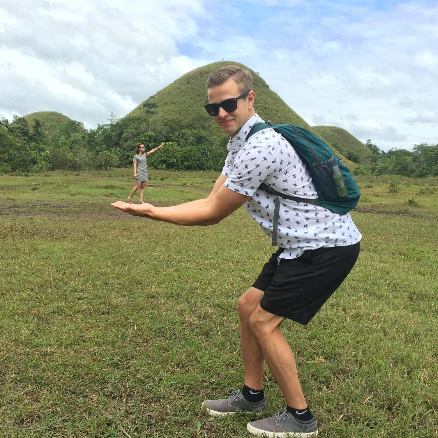 Taking touristy photos at the Chocolate Hills in Bohol, Philippines.