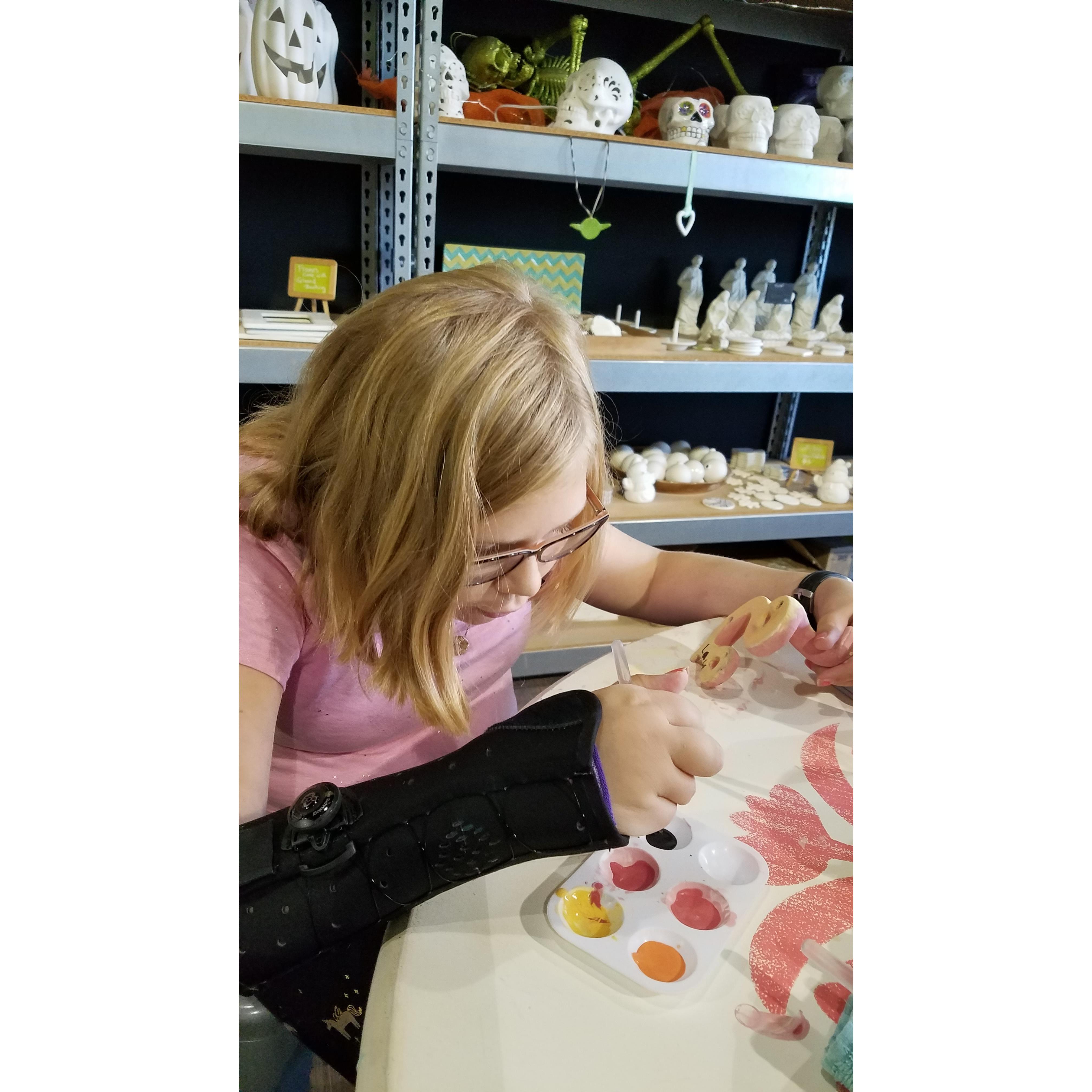 Lauren very focused on painting her snake!