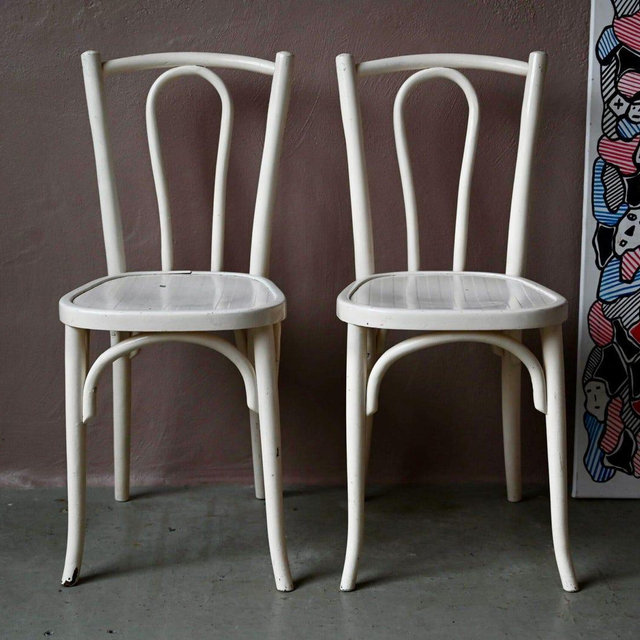 Pair of antique and boho style curved wooden bistro chairs by Baumann