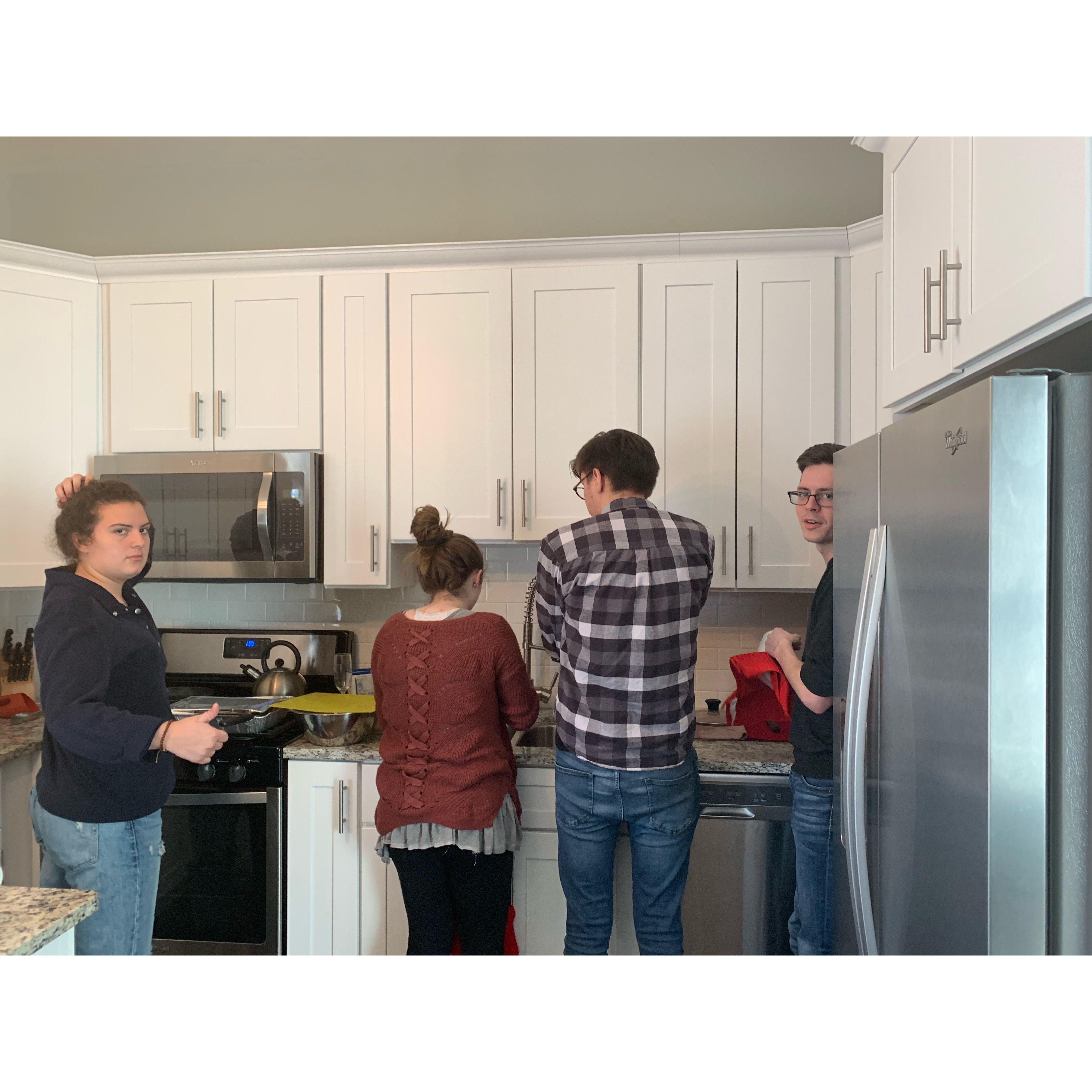 One of our first photos together with our dear friends (now married), Anna and Wyatt! Little did we know we'd spend the rest of our lives washing dishes with each other.