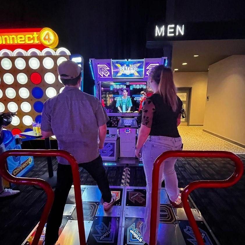 Jenny kicking Jacob’s butt at dance dance revolution