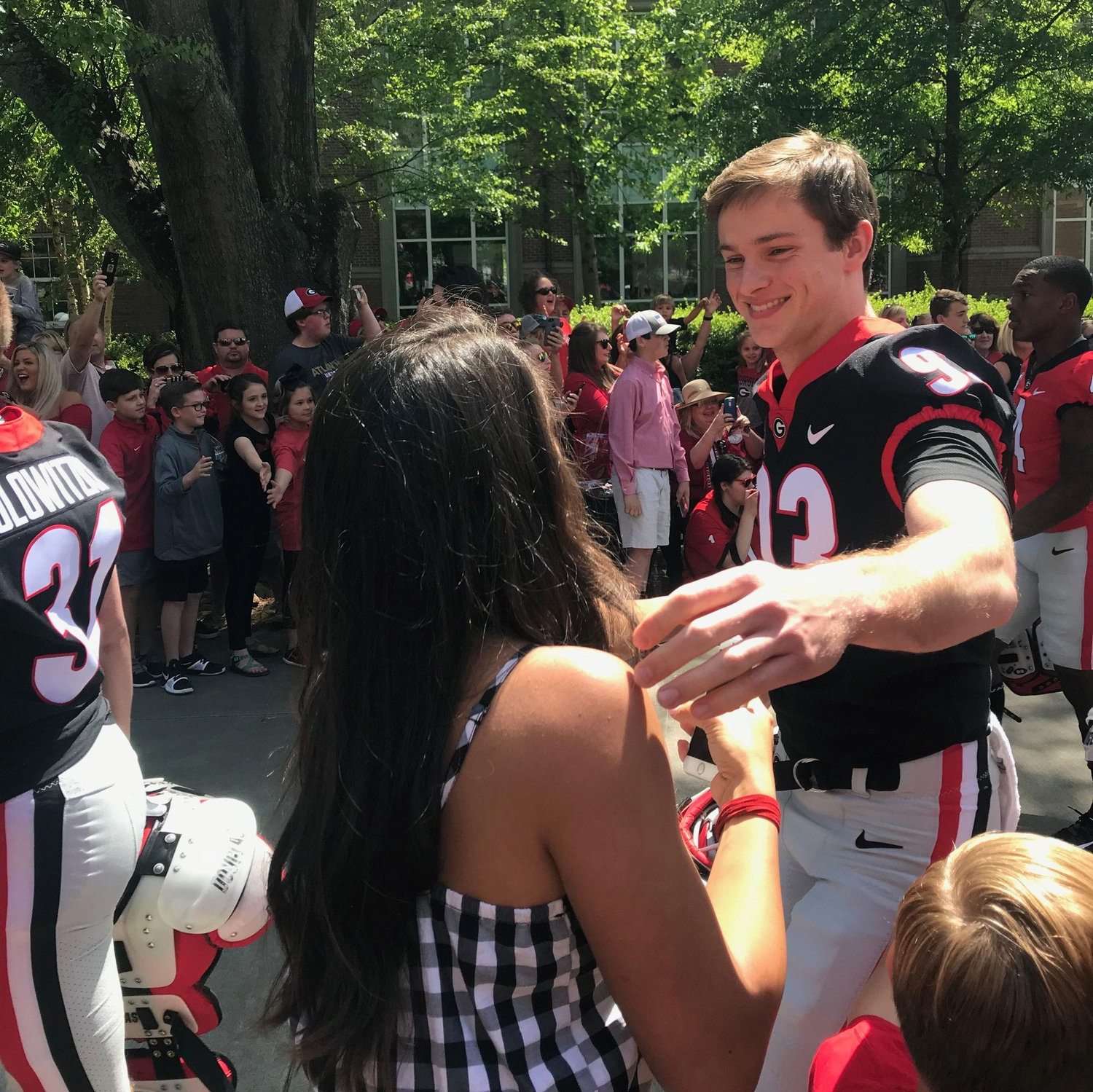 Charlotte's favorite part of game day was finding Bill during the pre-game "Dawg Walk" to Samford Stadium.