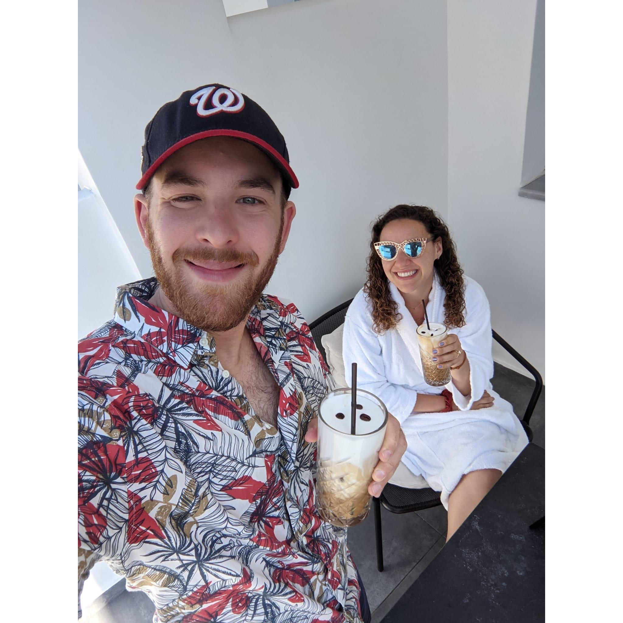 Enjoying a couple freddo cappuccinos on a beatiful morning in Santorini, Greece during our ProposalMoon™.