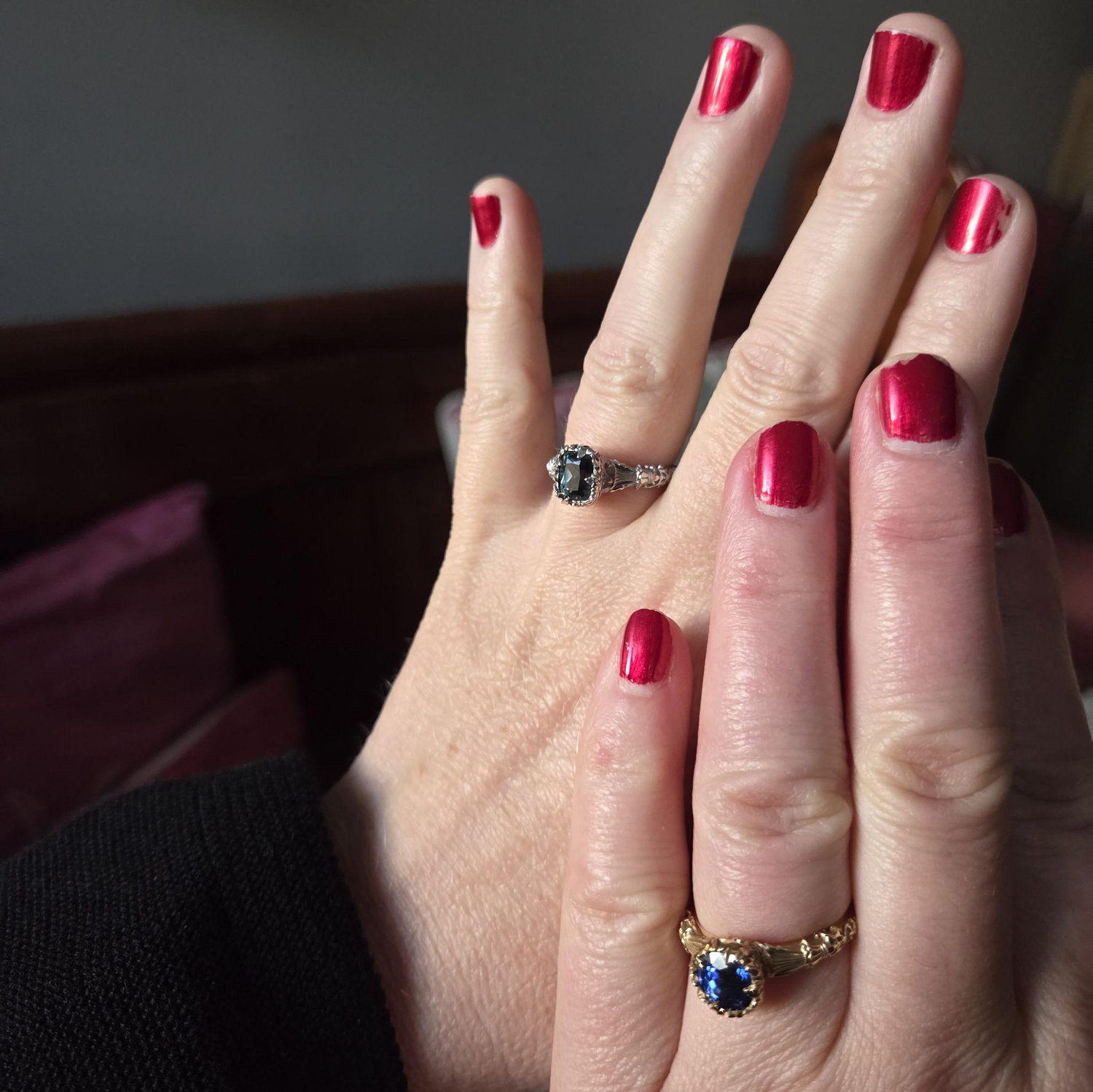 Admiring our rings in the light from the hotel window a few days after we got engaged.