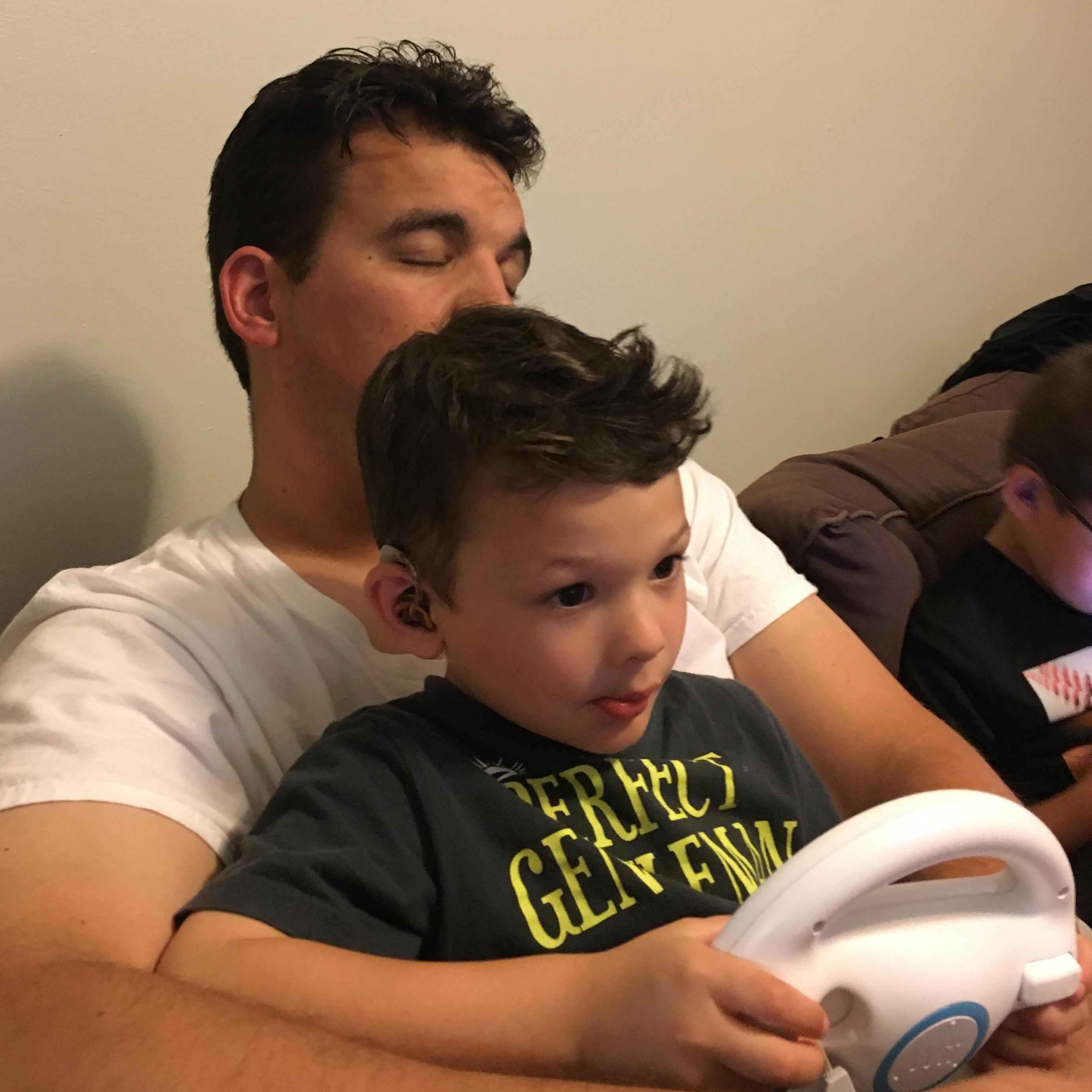 Scott helping Kohen at Mario Kart
...or falling asleep... who knows?