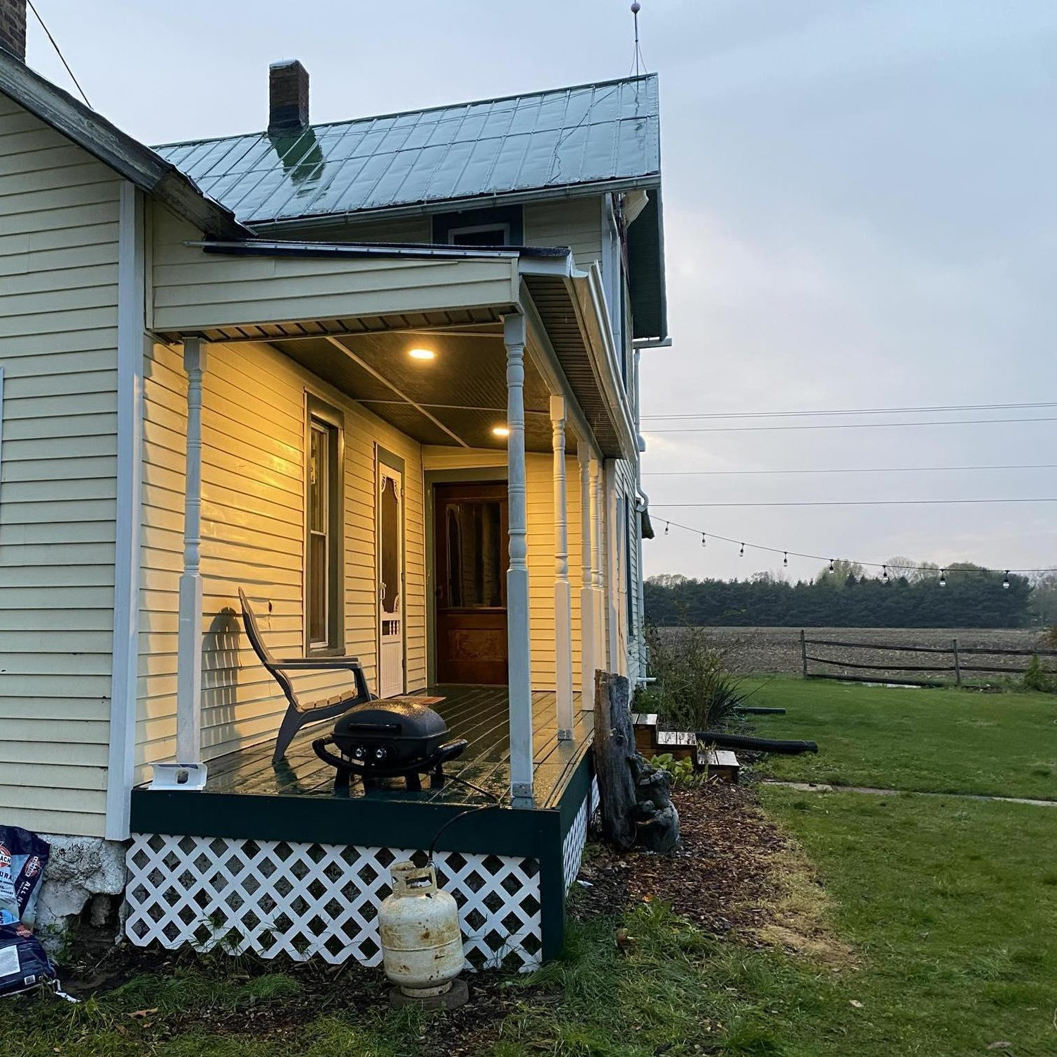 Beautiful porch totally done including the addition of lights!