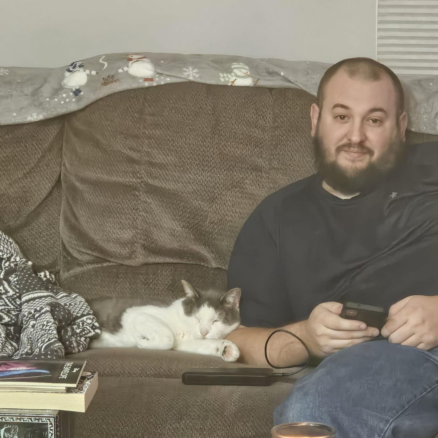 Swears he does not like cats, but this one "is a weird looking dog".