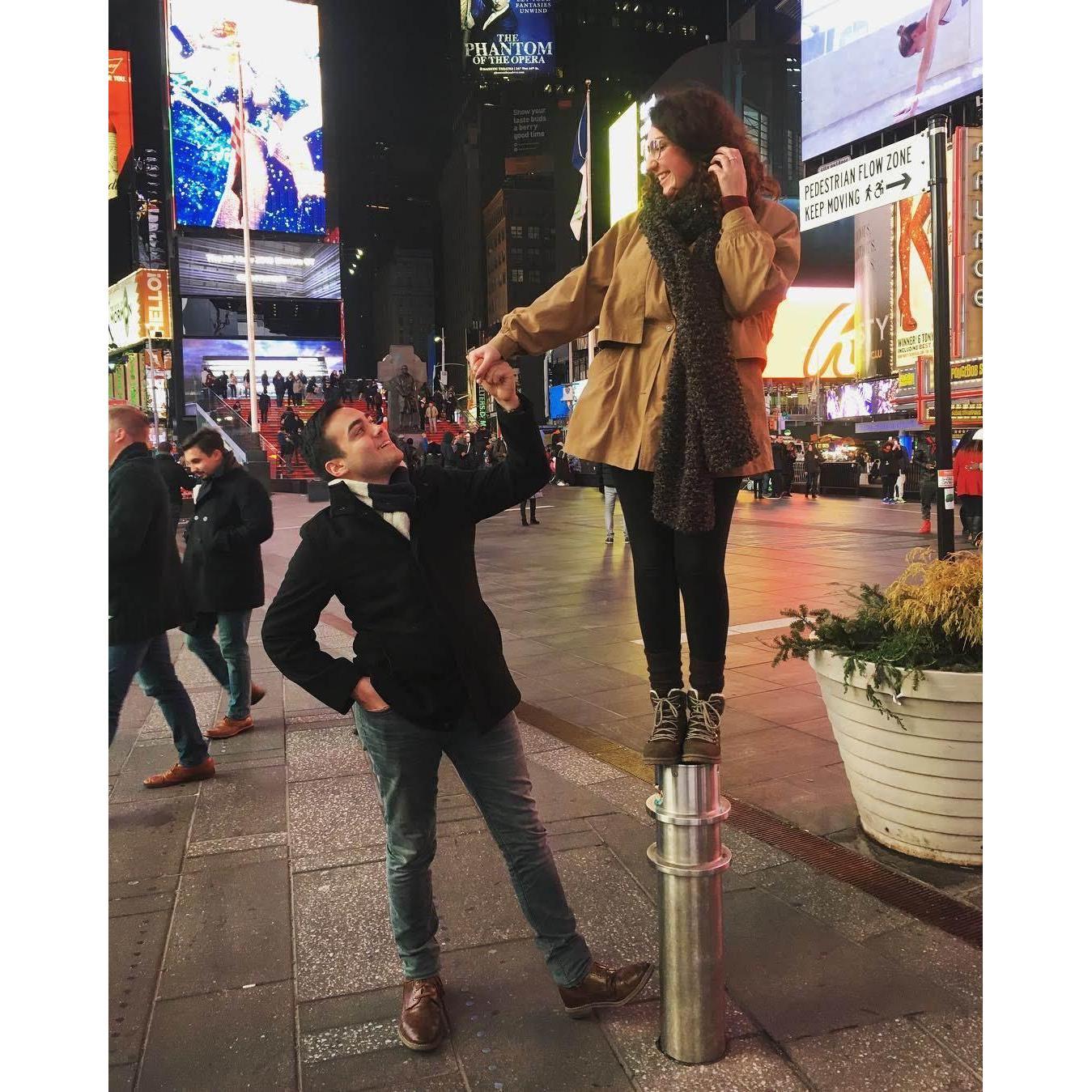 first time in times square! a passerby insisted on taking a photo of us