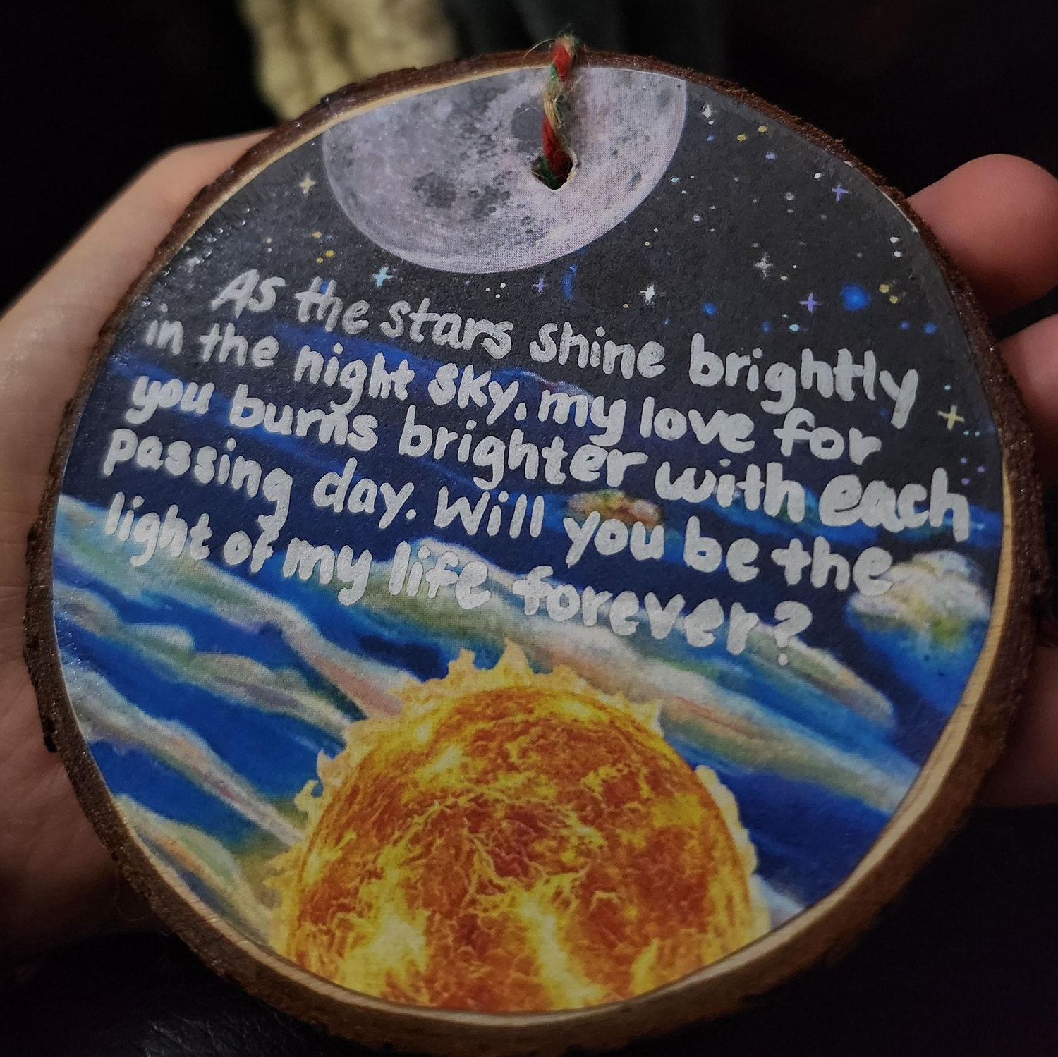 (Side 1) Hannah proposed with an ornament. Hannah & Abby make homemade ornaments every year so the proposal was special to them.