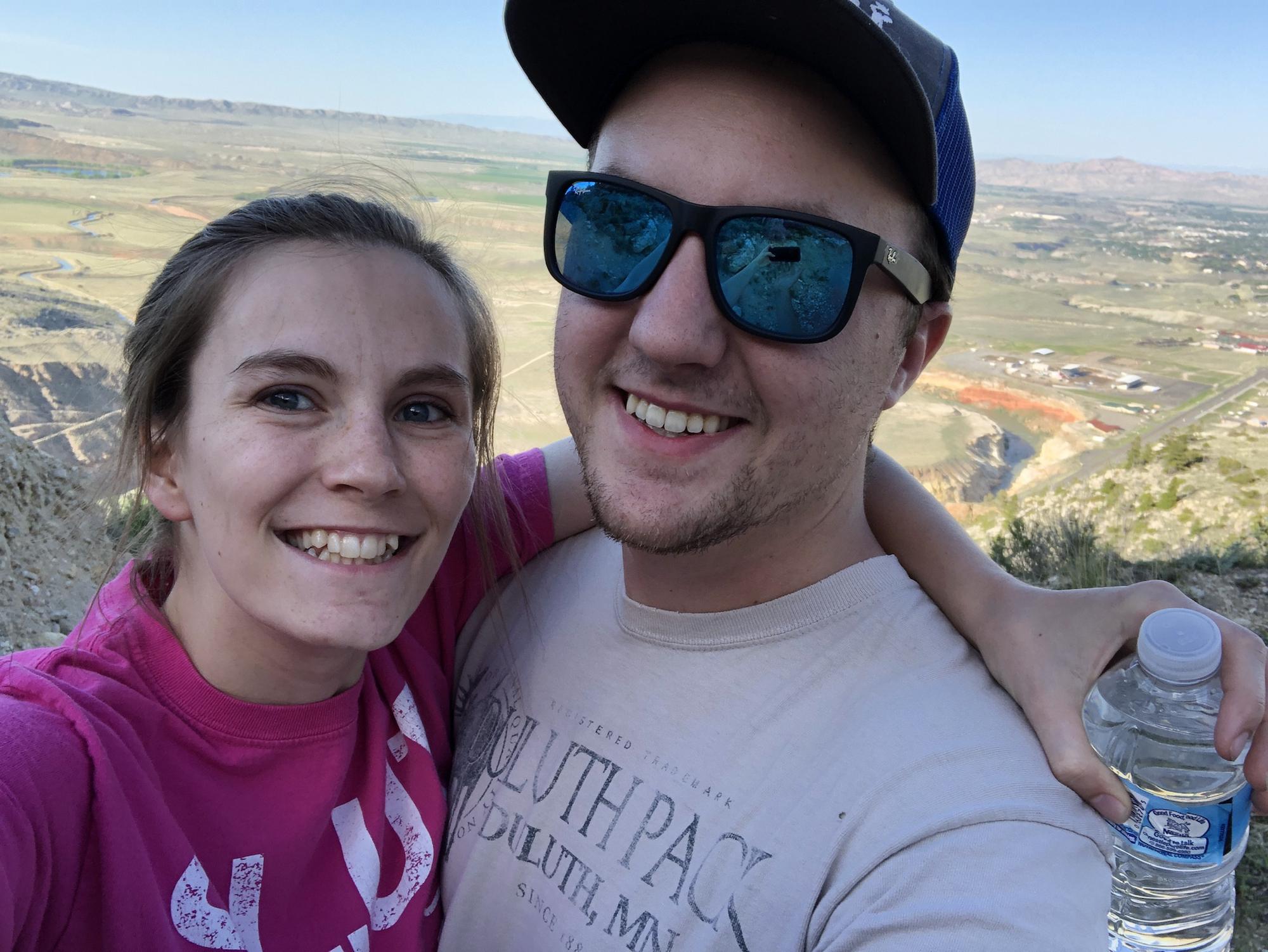 Hiking Cedar Mountain with a background view of Cody