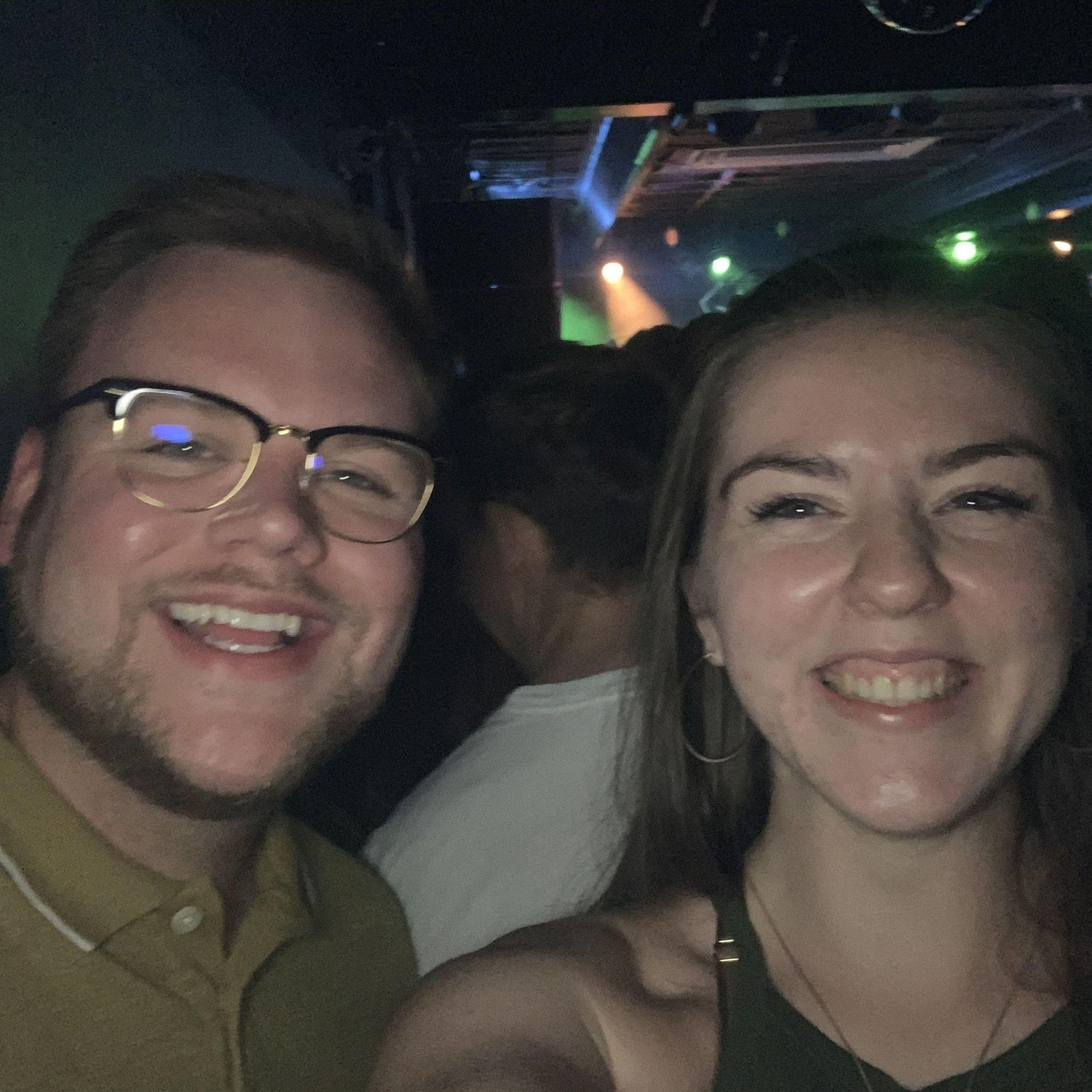 Our first photo together! Taken at a concert, our fourth date.