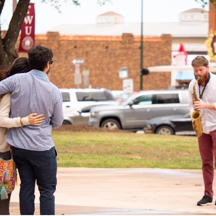 The proposal was at one of our favorite places, the Denton Square. Julian's friend and fellow sax player, Devin Eddleman, serenaded Alice with her favorite jazz tune Emily by Johnny Mandel.
