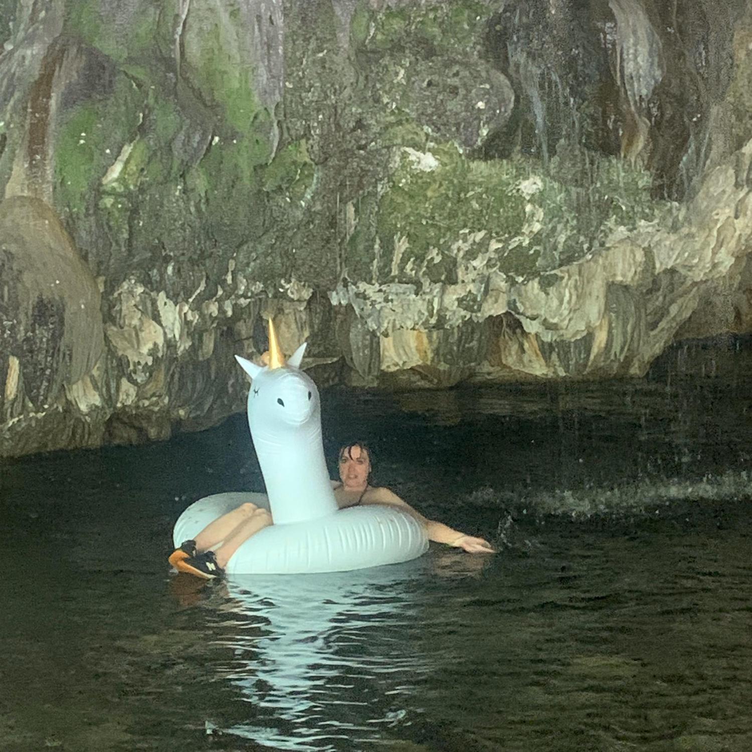 Rocky floats on a unicorn through the waterfall cave at Natural Bridges in Angels Camp.