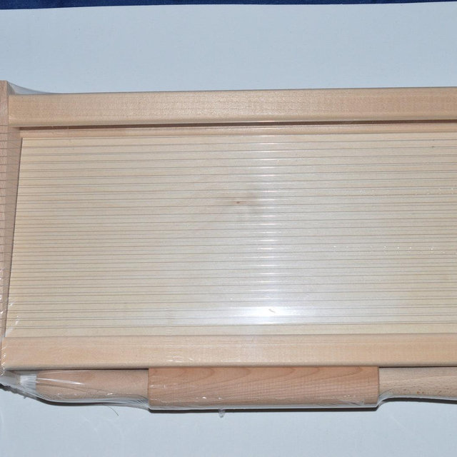 Large wooden pasta cutter guitar with rolling pin. Measures 43 x 22 cm