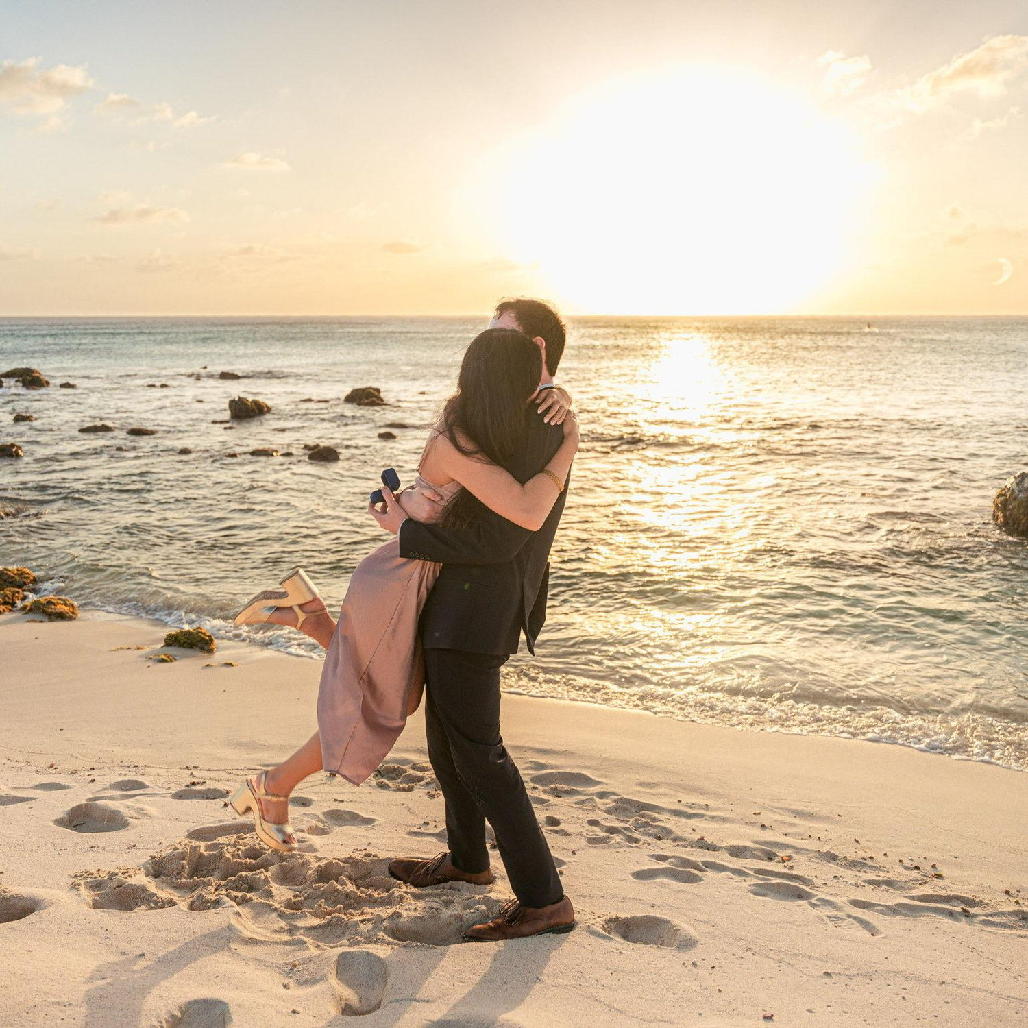 The photographer was posing us and then had us stand back to back. Then he instructed us to turn around. When Lauren turned around Evan was proposing and it was the most beautiful and exciting moment!