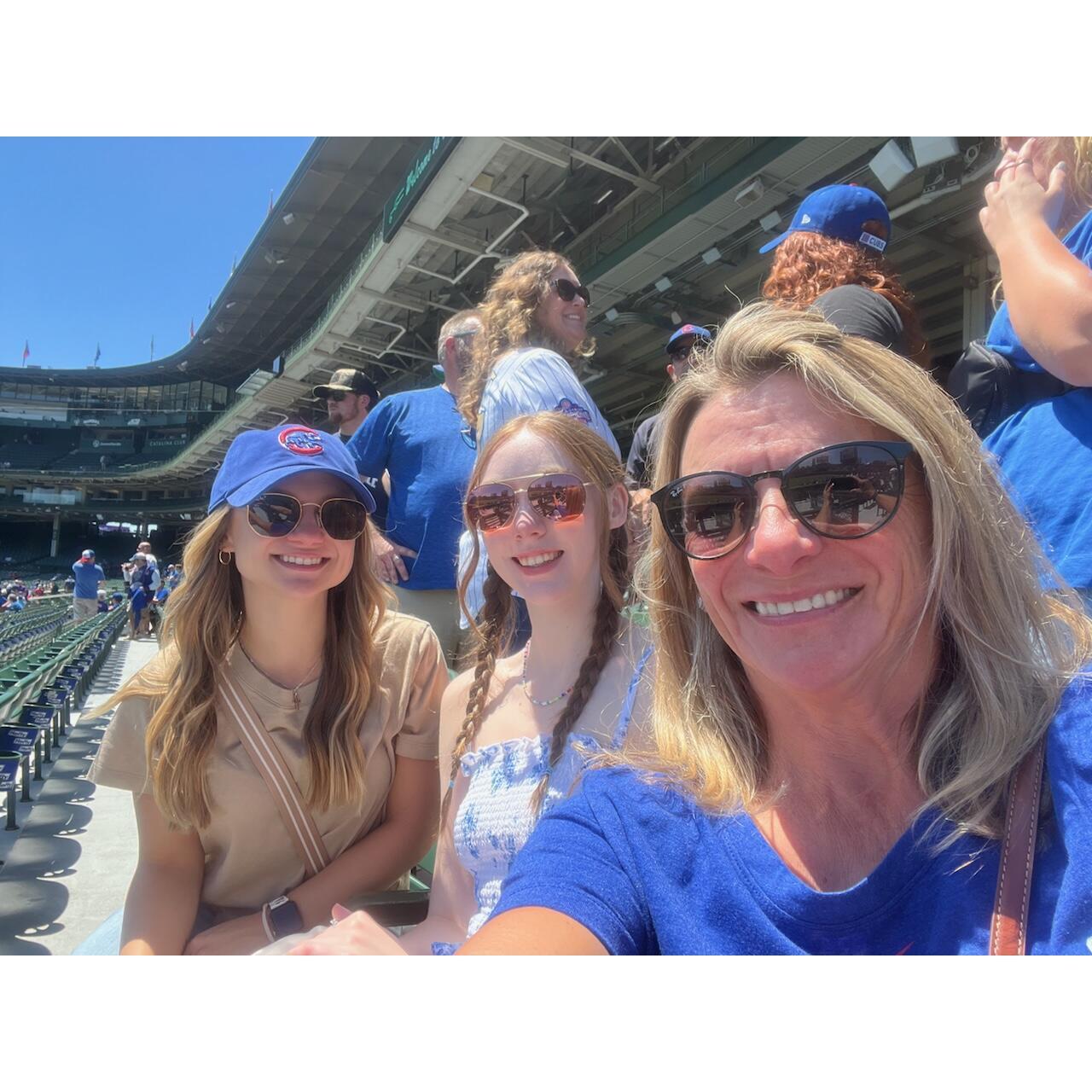 The lady's waiting for the Cubs game to start at Wrigley field.