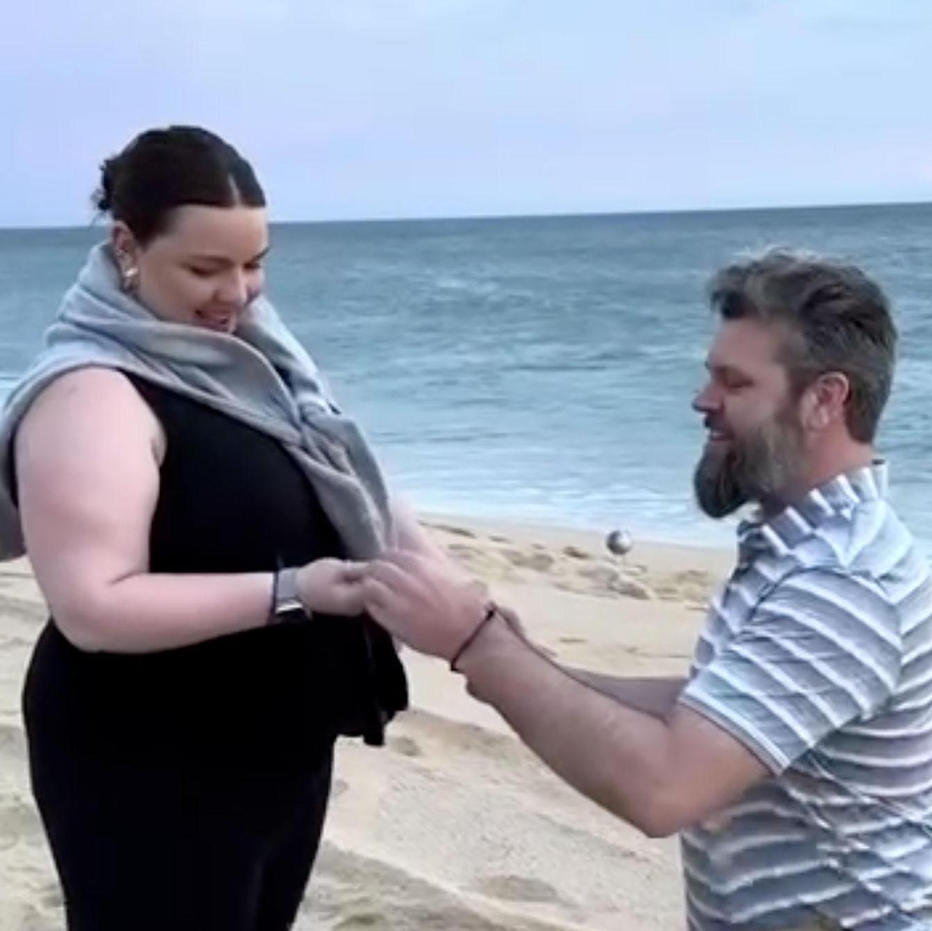 Erica's first instinct was to hold the ring in the palm of her right hand so she could inspect it closer - As seen in the first photo of this page, she did allow Jim to place it on her ring finger
