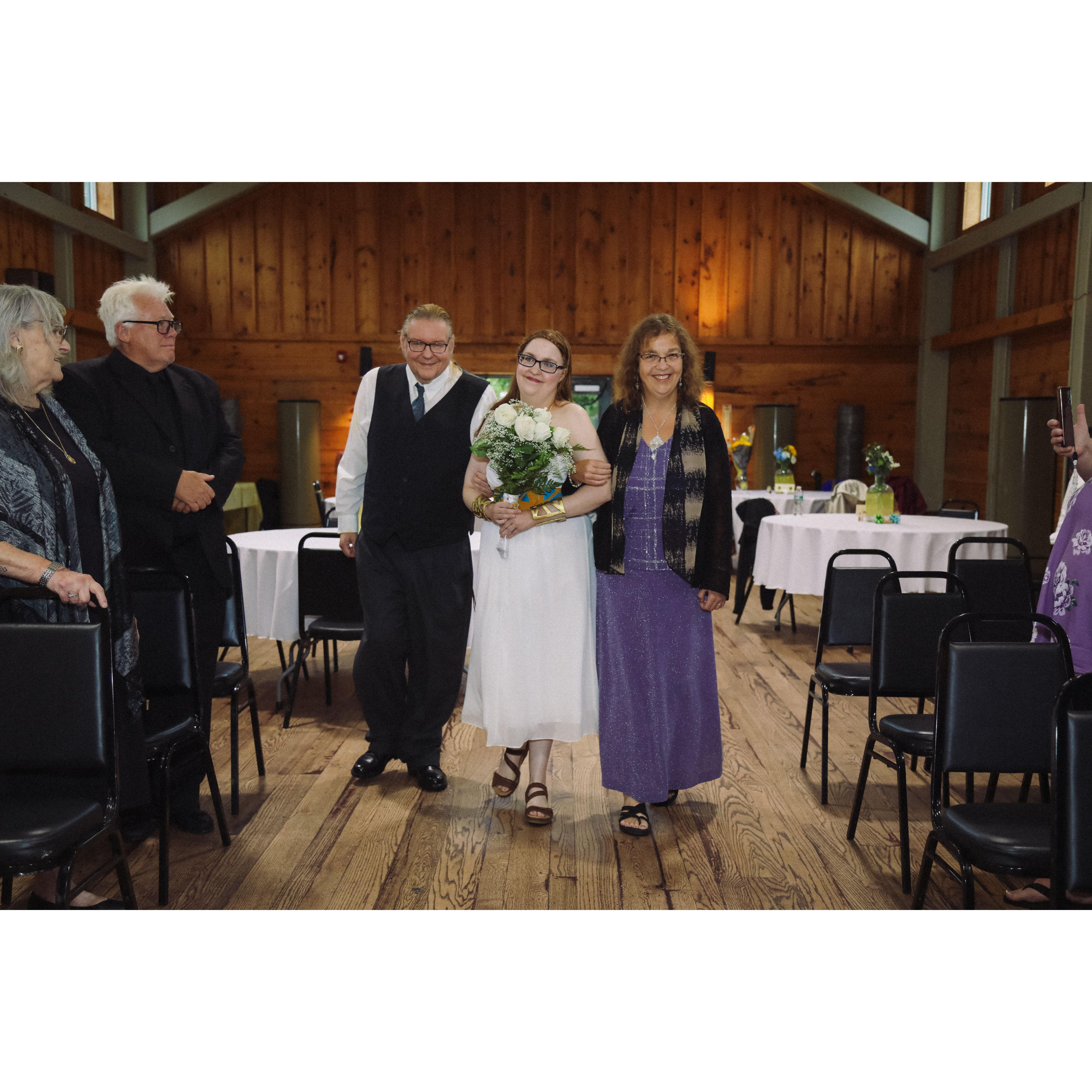 during the ceremony, Tim, Sara and Jessica walking down the aisle