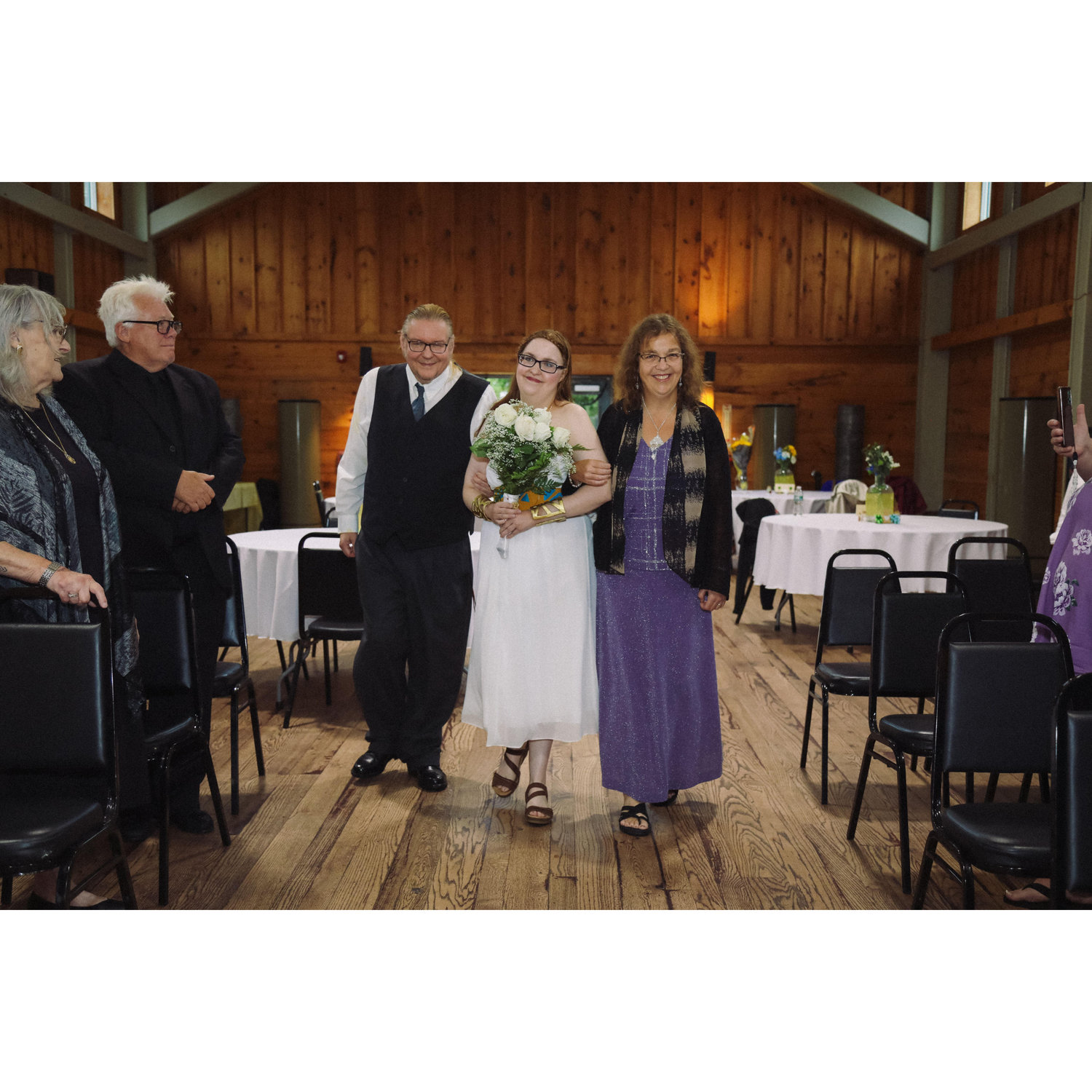 during the ceremony, Tim, Sara and Jessica walking down the aisle