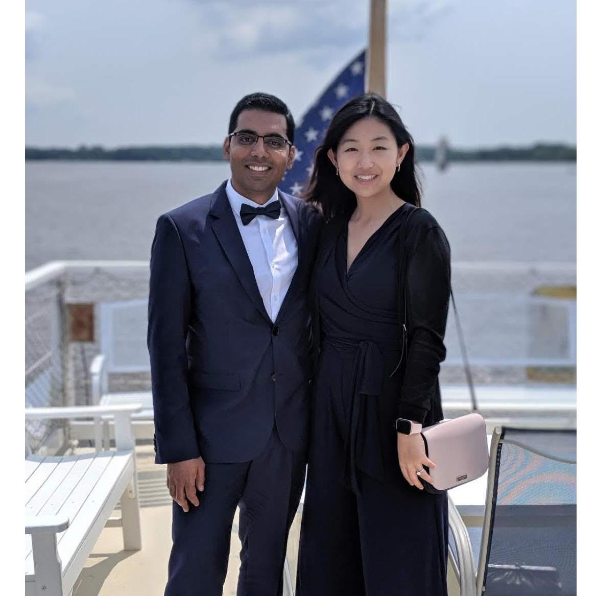 At a friend's wedding in Maryland. What does a man do with his hand, other than awkwardly place it on his thigh.