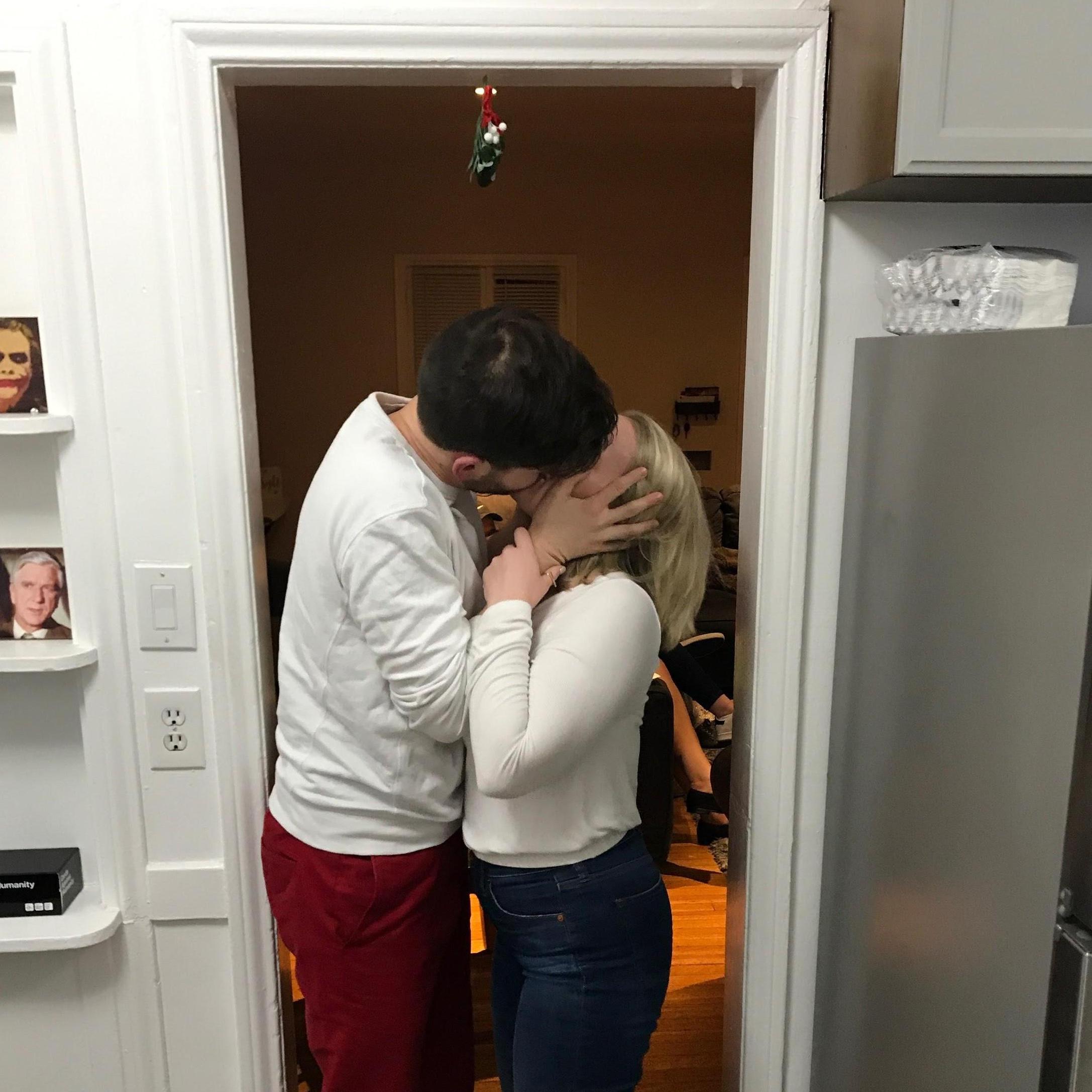 We kiss under mistletoe with Leslie Nielsen.